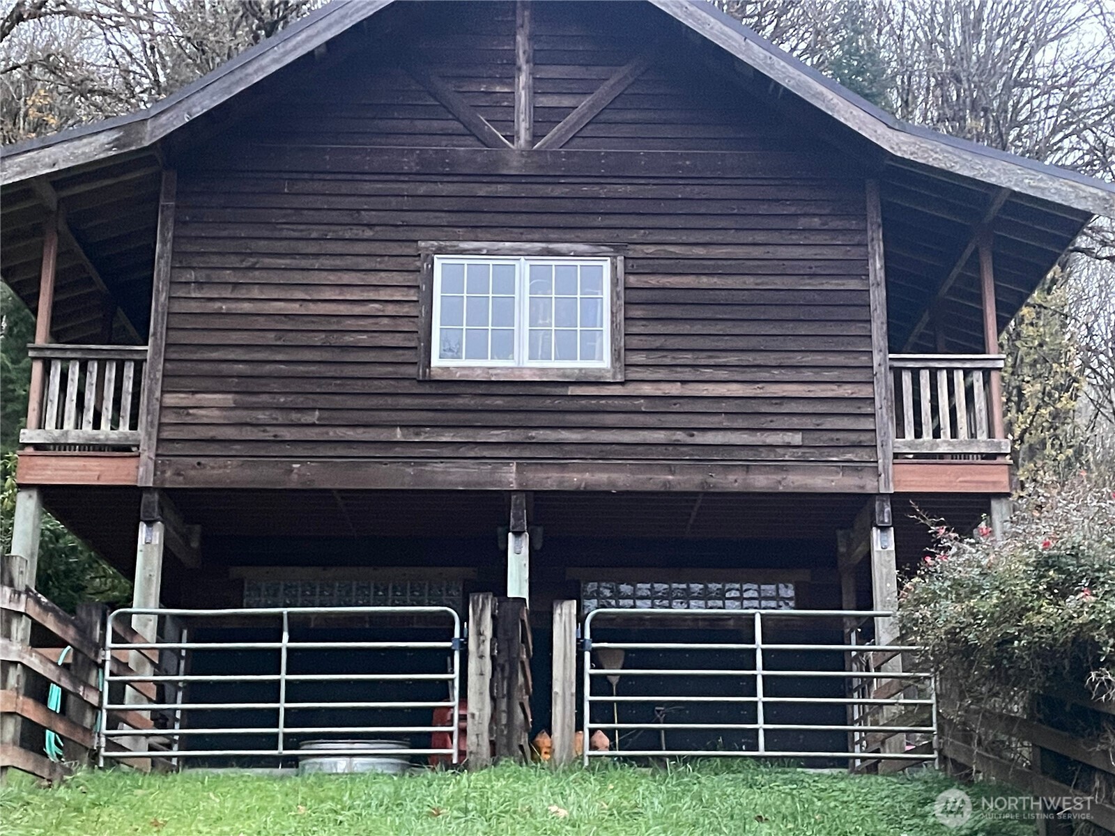 106 Crocker Lake Road Quilcene, WA 98376 - Photo 5 of 34 a front view of a house with garden