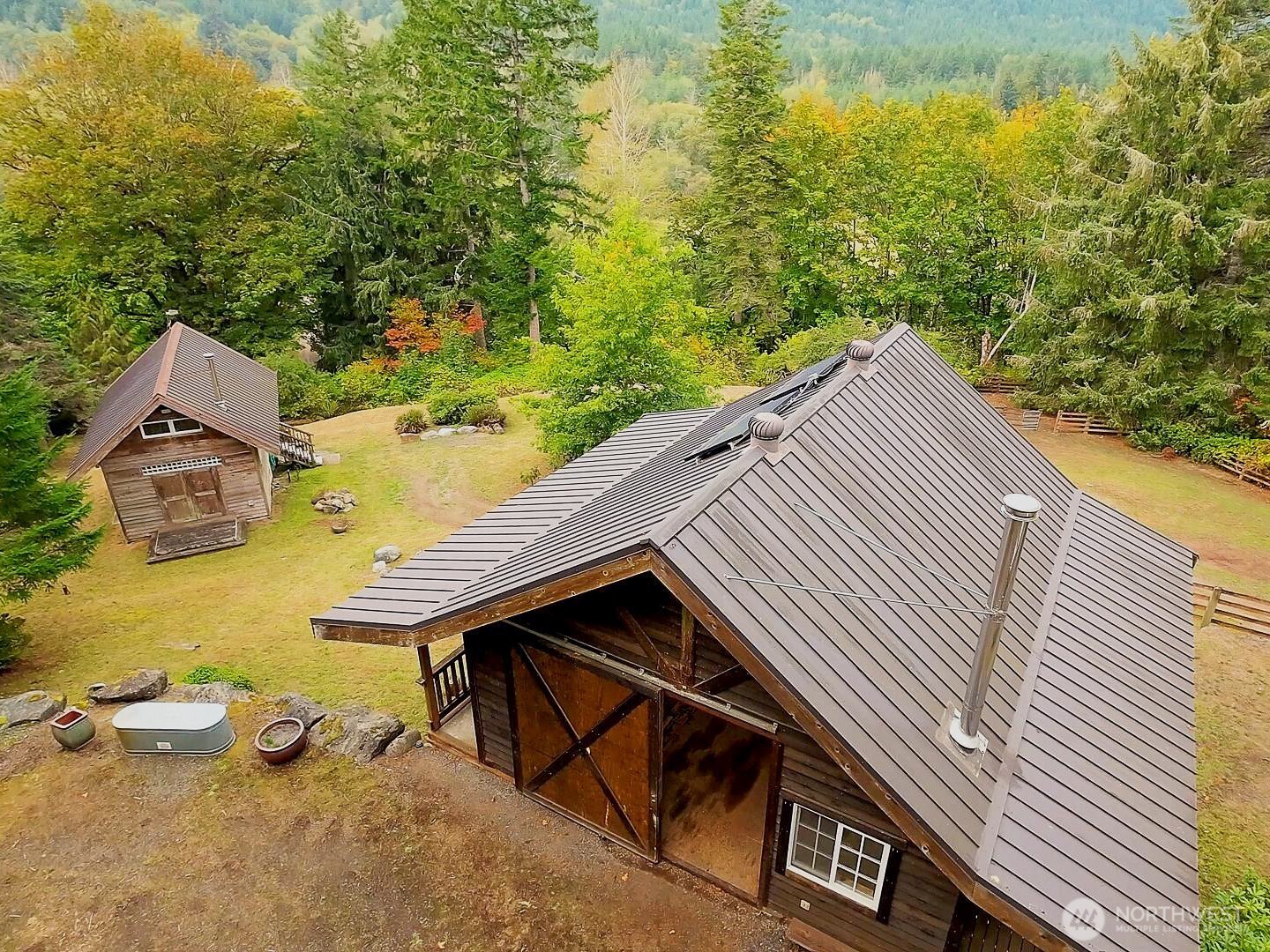 106 Crocker Lake Road Quilcene, WA 98376 - Photo 6 of 34 a view of a terrace with two chairs and a table