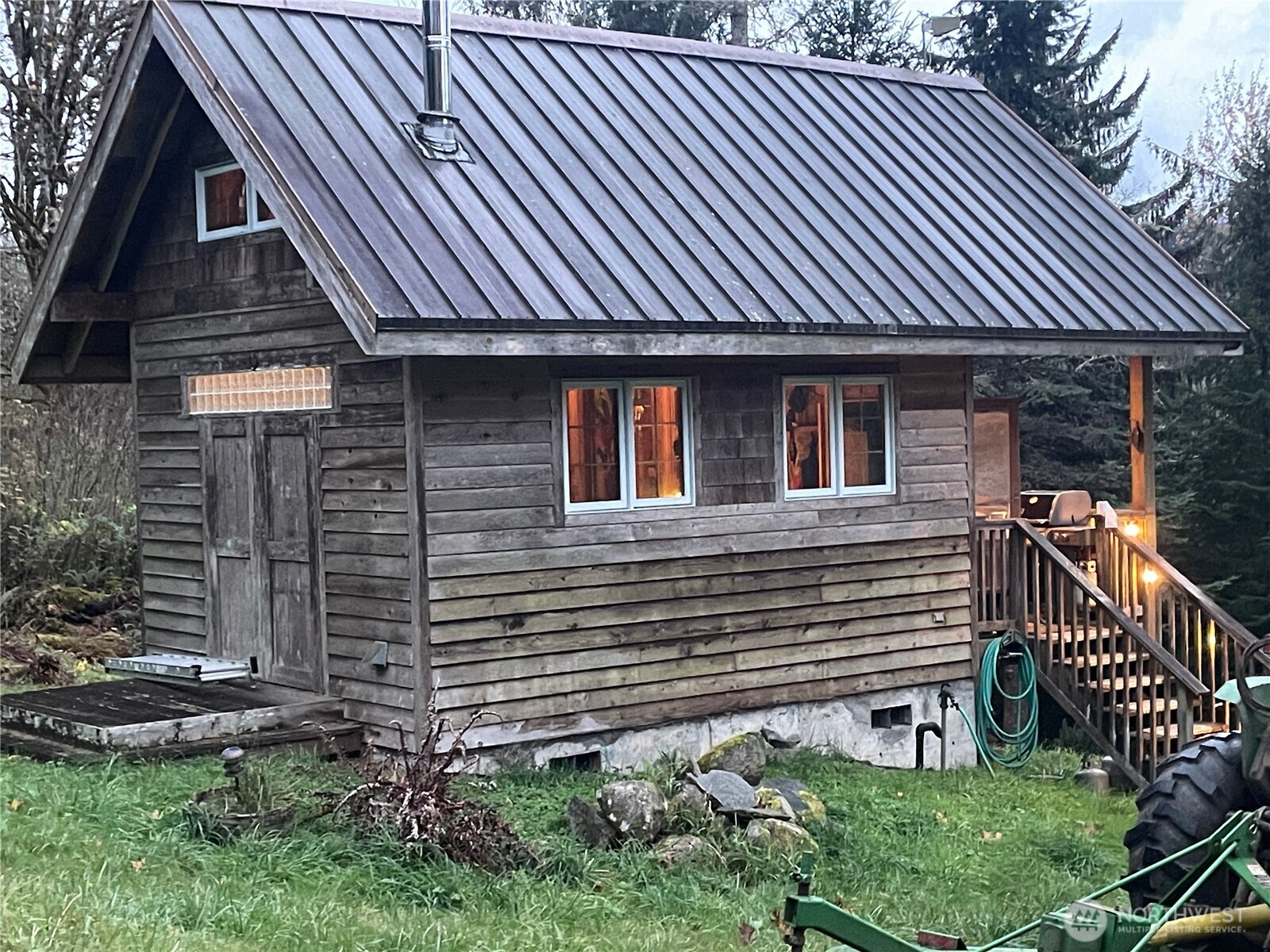 106 Crocker Lake Road Quilcene, WA 98376 - Photo 8 of 34 a front view of a house with garden