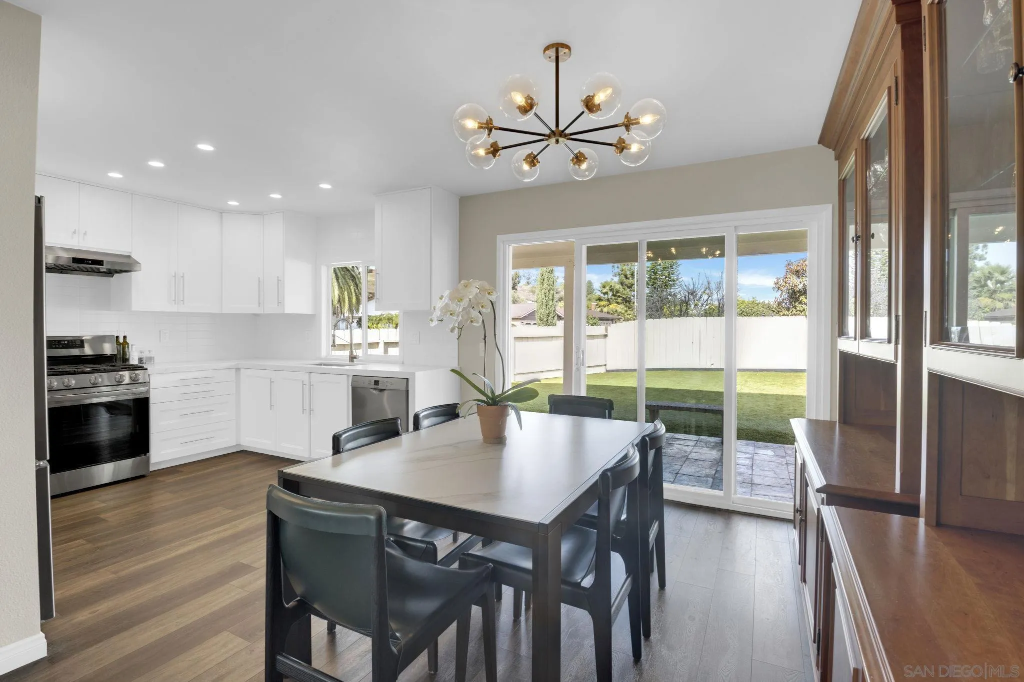 12408 Laja Drive Poway, CA 92064 - Photo 11 of 41 a view of a dining room with furniture window and wooden floor