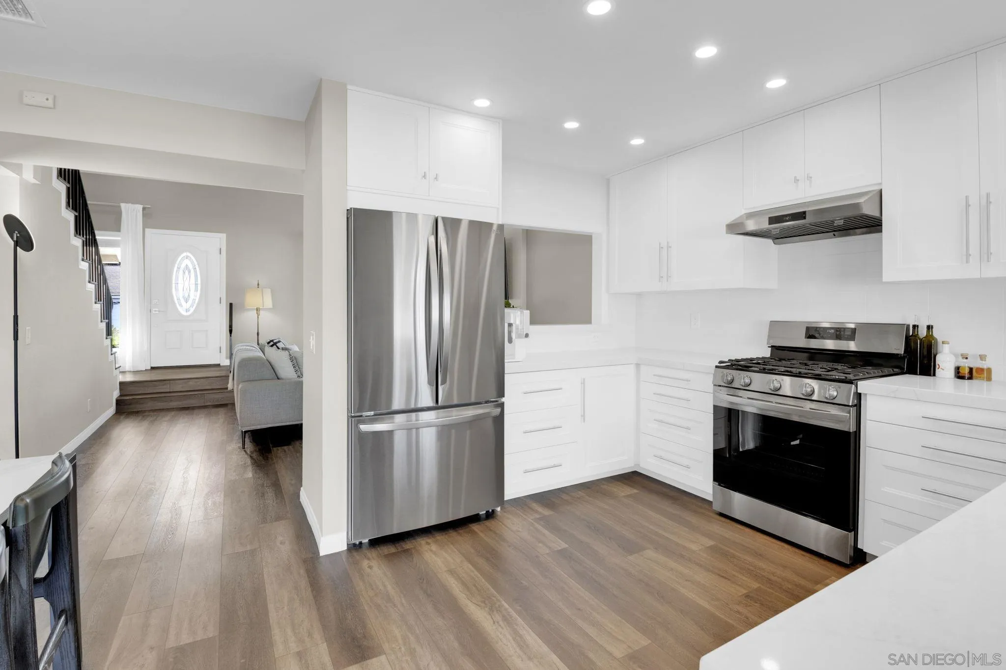 12408 Laja Drive Poway, CA 92064 - Photo 13 of 41 a kitchen with stainless steel appliances a refrigerator and a stove top oven