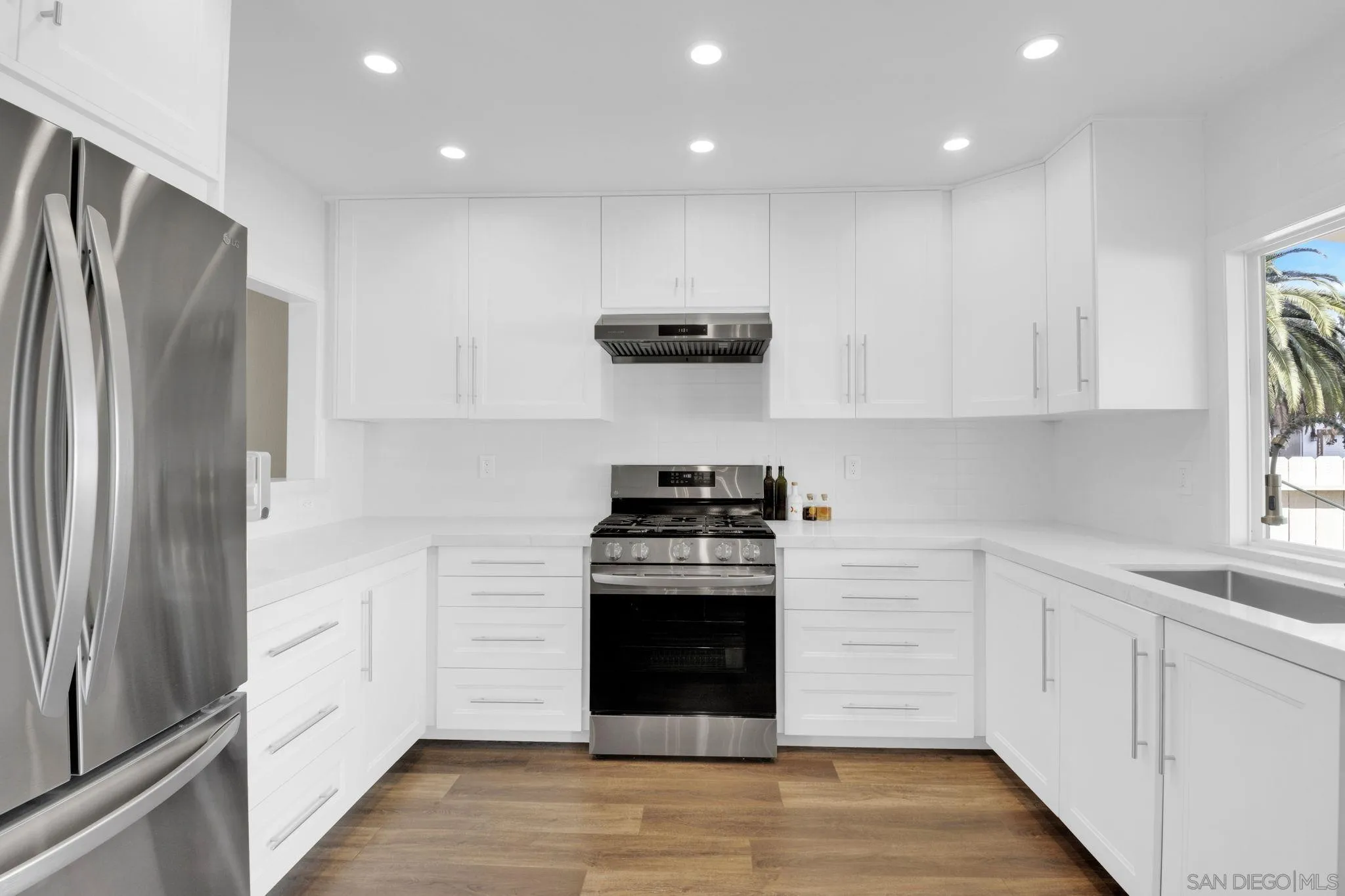 12408 Laja Drive Poway, CA 92064 - Photo 15 of 41 a kitchen with a stove and a refrigerator