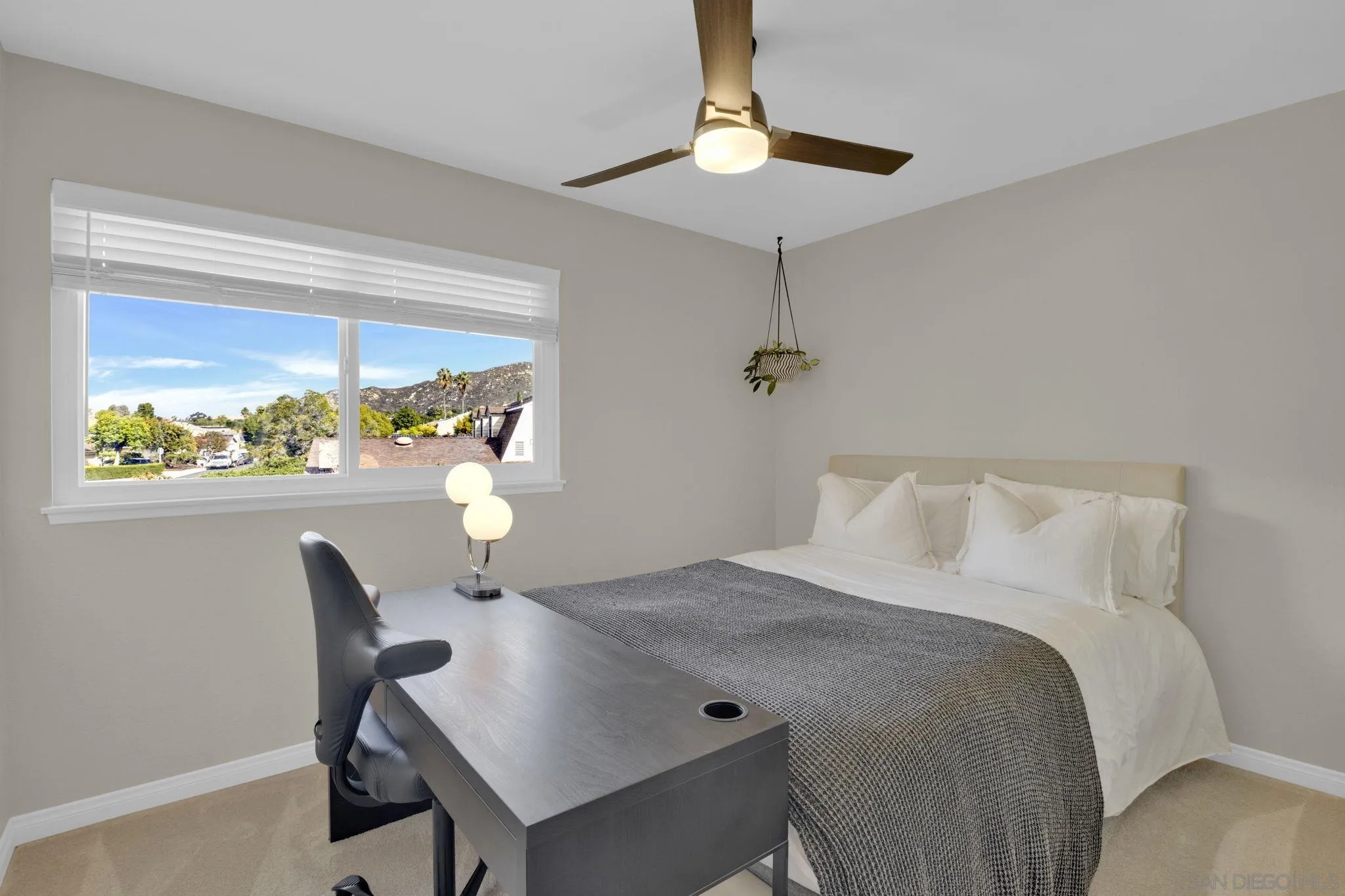 12408 Laja Drive Poway, CA 92064 - Photo 19 of 41 a bedroom with a bed and a table