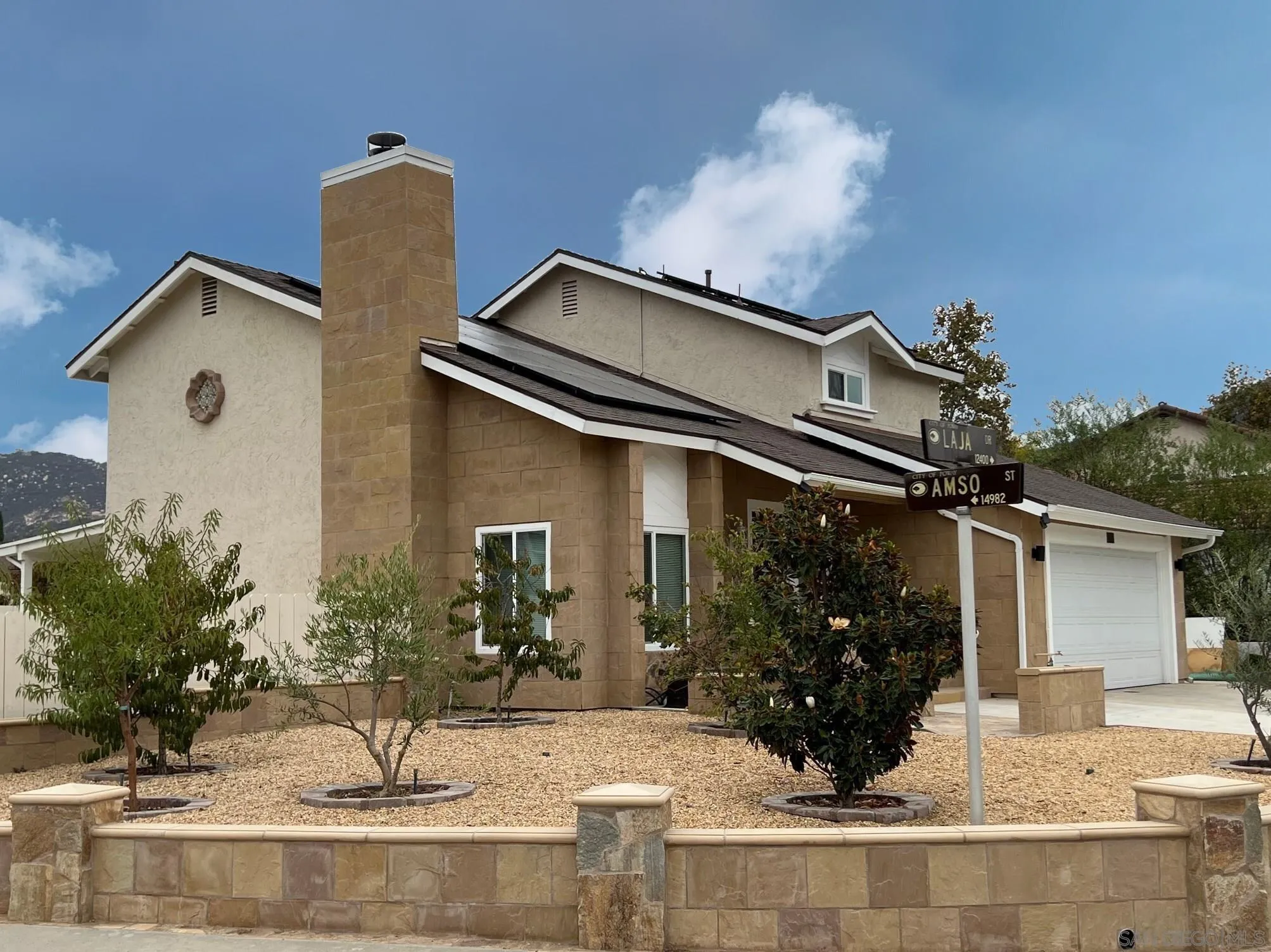 12408 Laja Drive Poway, CA 92064 - Photo 2 of 41 a front view of a house with garden