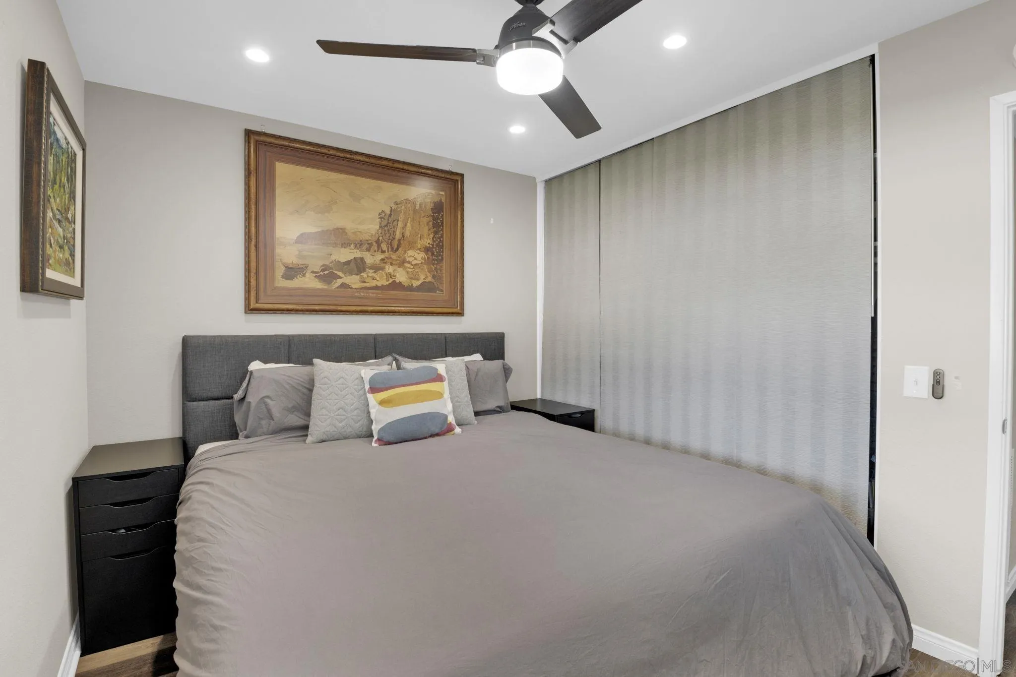 12408 Laja Drive Poway, CA 92064 - Photo 21 of 41 a bedroom with a large bed and a chandelier