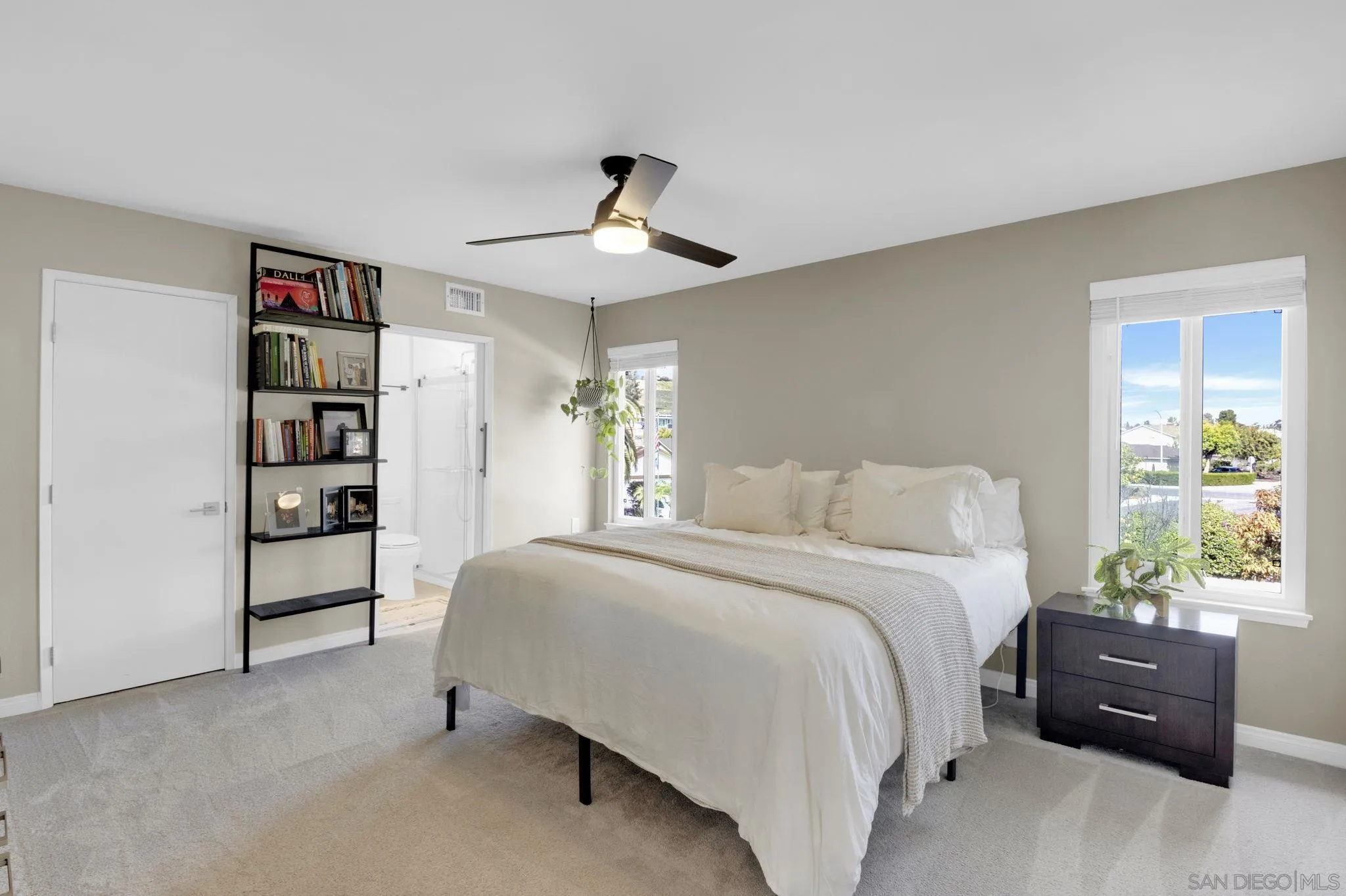 12408 Laja Drive Poway, CA 92064 - Photo 23 of 41 a spacious bedroom with a bed and a window