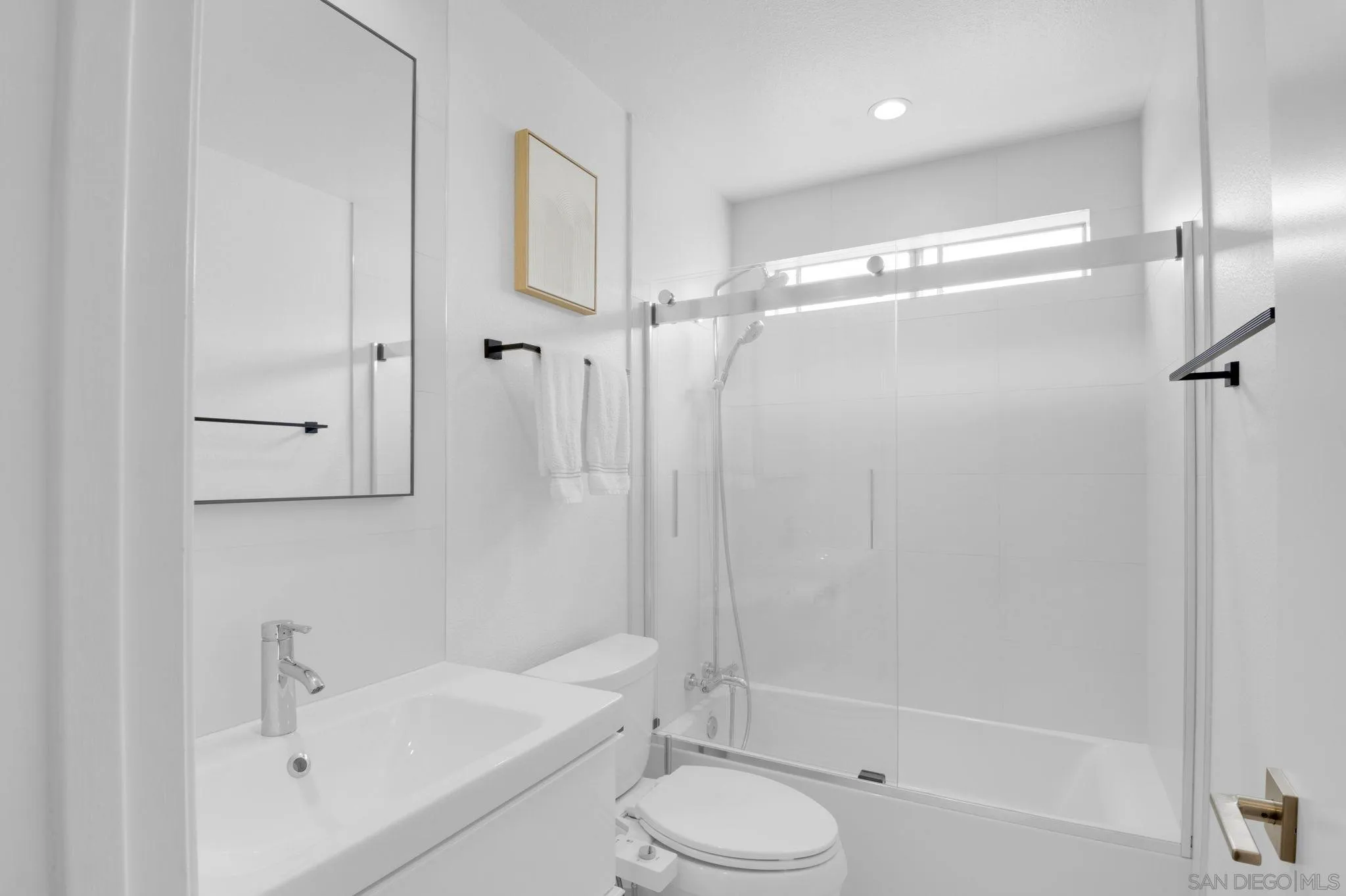 12408 Laja Drive Poway, CA 92064 - Photo 27 of 41 a bathroom with a sink toilet and shower