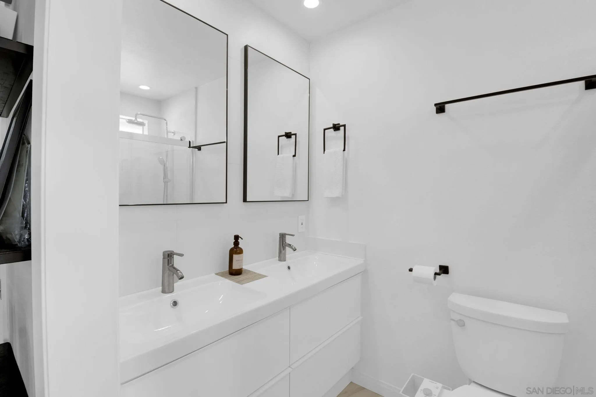 12408 Laja Drive Poway, CA 92064 - Photo 29 of 41 a bathroom with a sink a toilet and shower