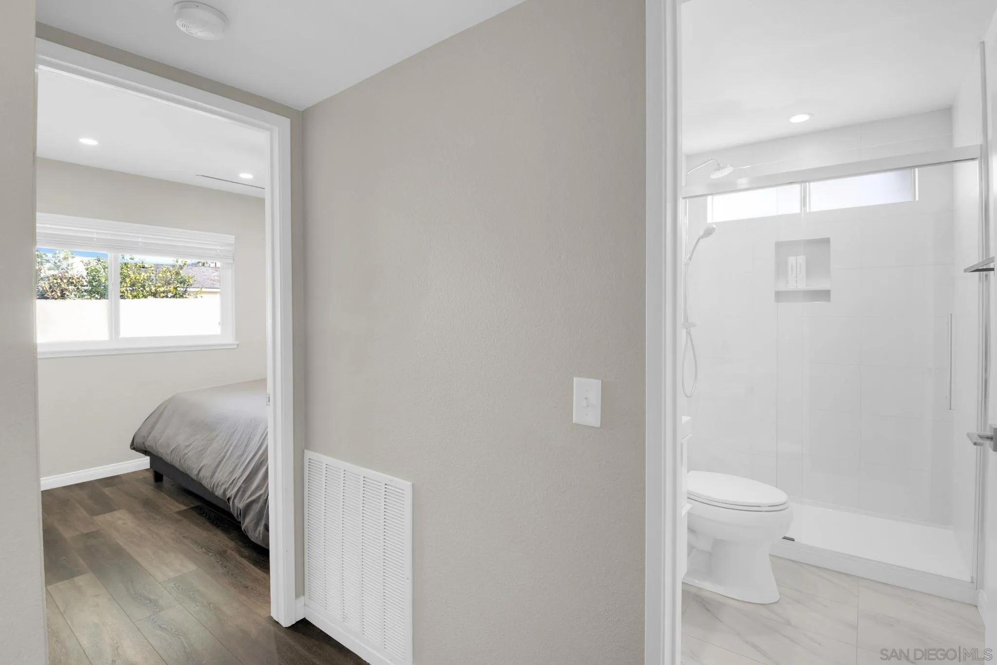 12408 Laja Drive Poway, CA 92064 - Photo 31 of 41 a en suite bathroom with a toilet sink and a mirror