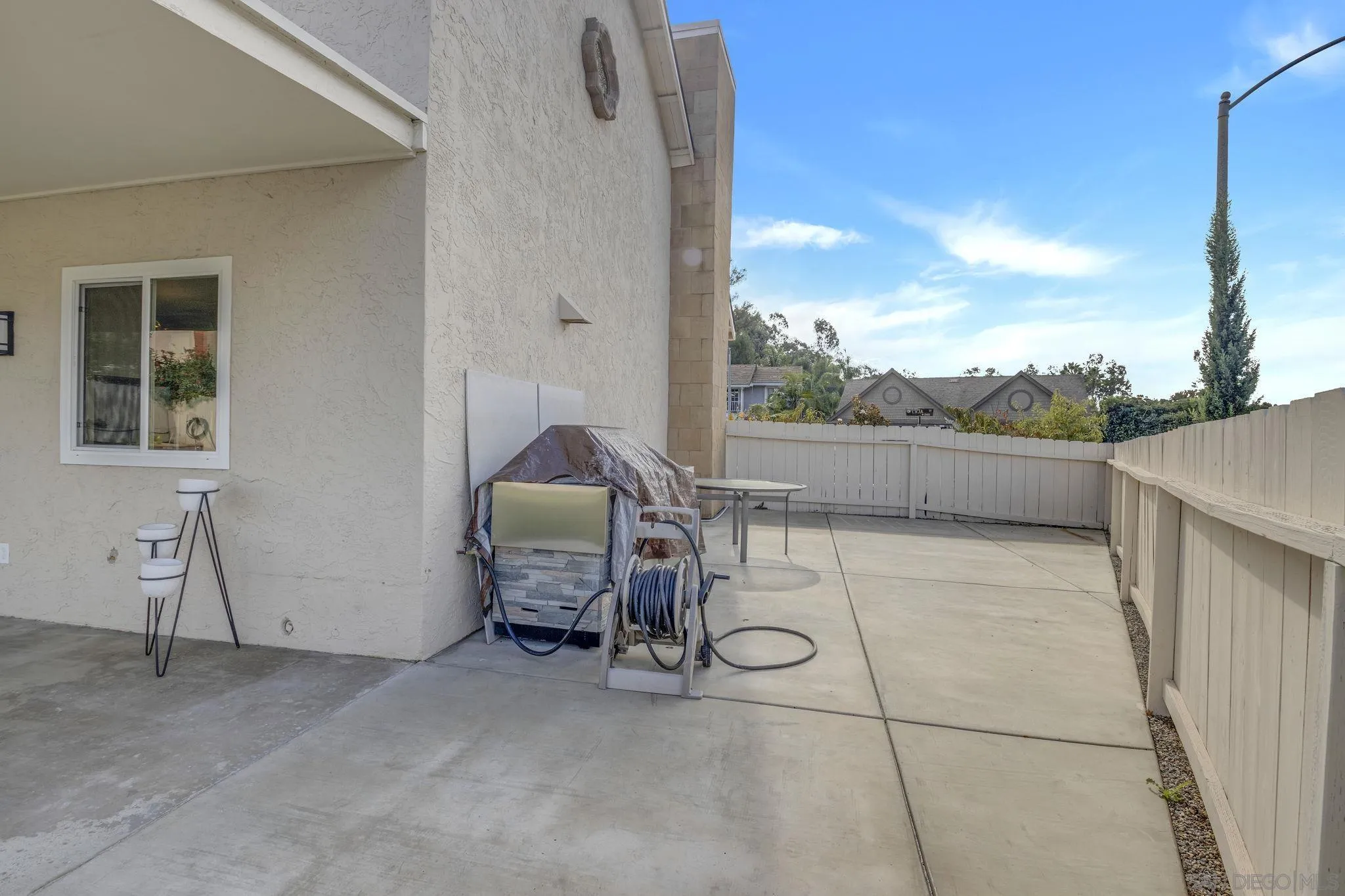 12408 Laja Drive Poway, CA 92064 - Photo 37 of 41 a view of a patio with table and chairs