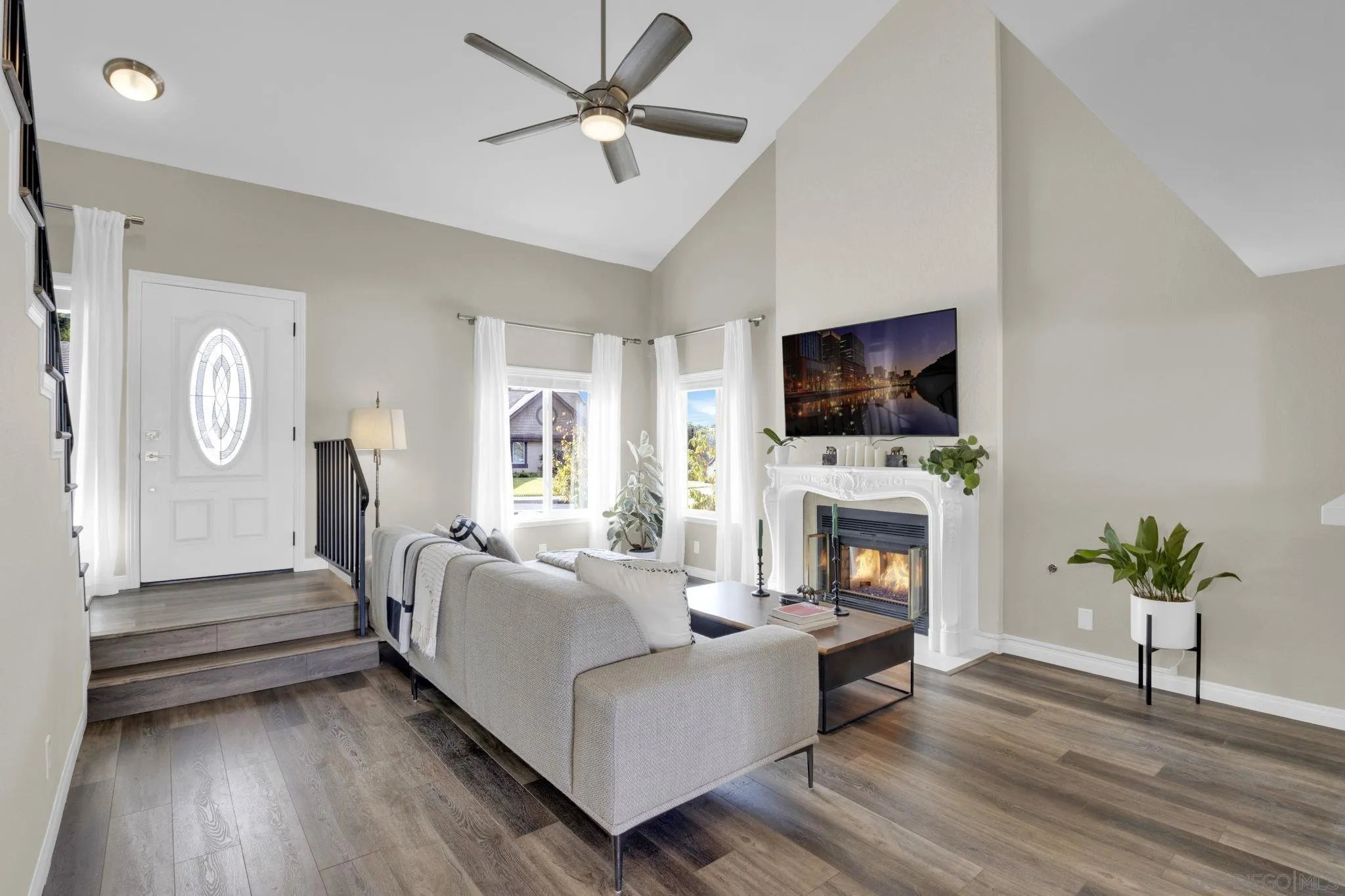 12408 Laja Drive Poway, CA 92064 - Photo 4 of 41 a living room with furniture fireplace and flat screen tv