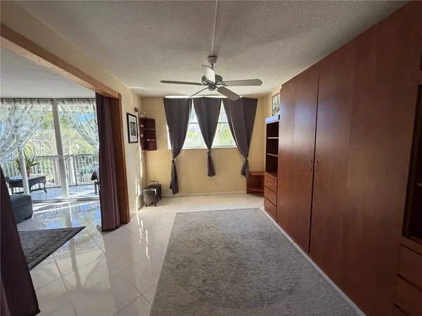 a bedroom with a bed and a table in it