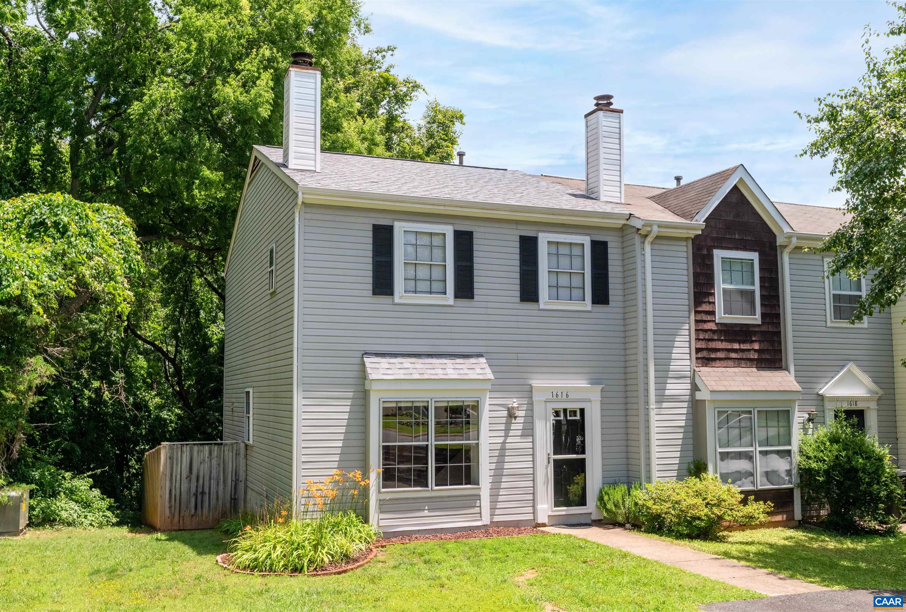 1616 Cool Spring Road Charlottesville, VA 22901 - Photo 1 of 38 a front view of a house with a yard and potted plants