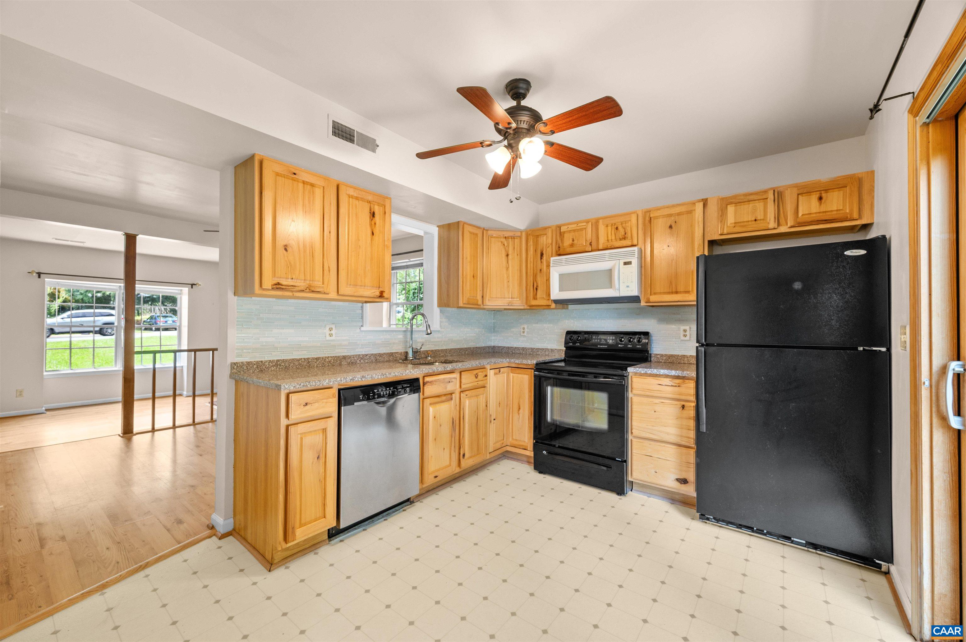 1616 Cool Spring Road Charlottesville, VA 22901 - Photo 13 of 38 a kitchen with granite countertop a refrigerator stove top oven and sink