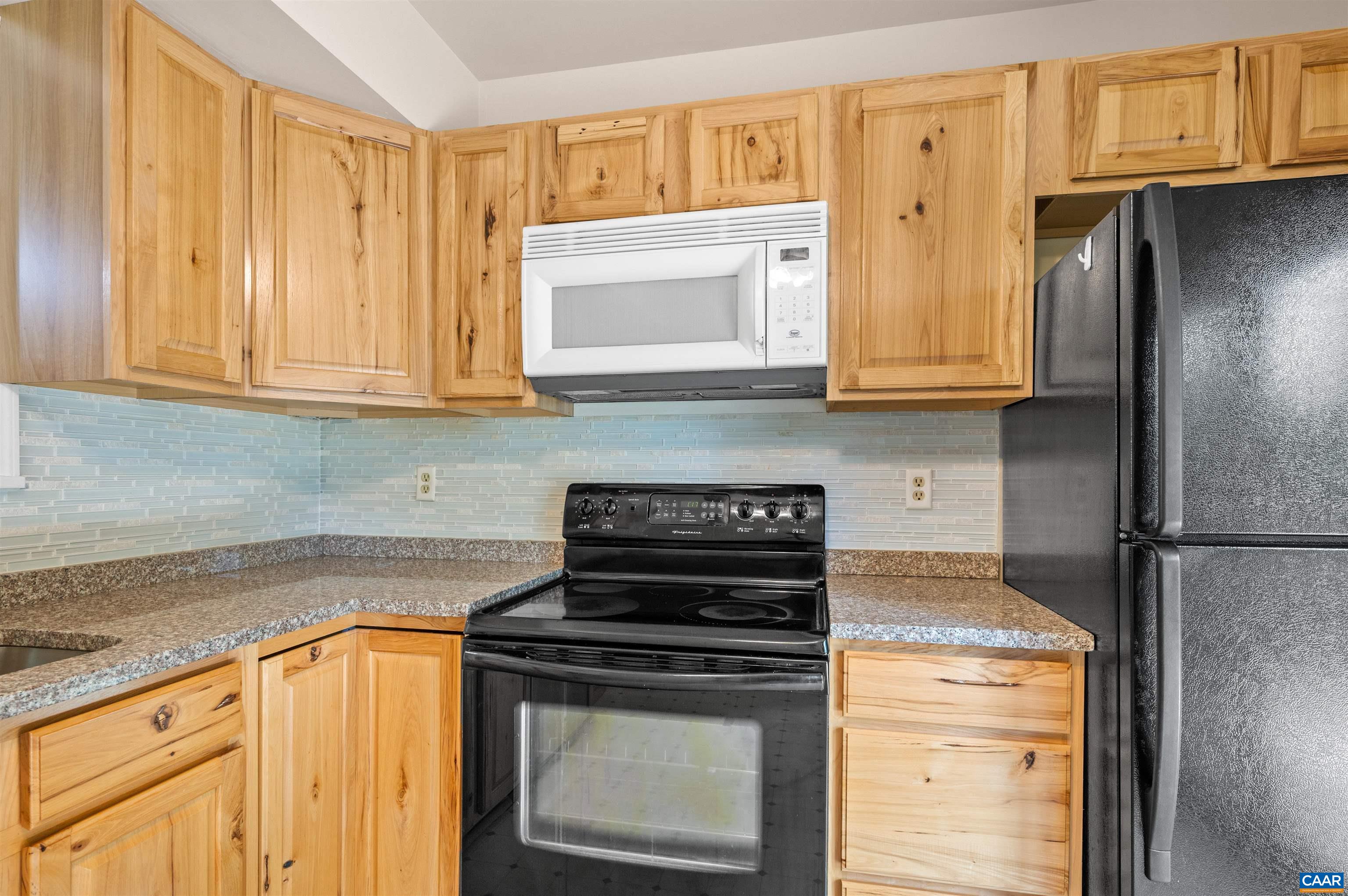 1616 Cool Spring Road Charlottesville, VA 22901 - Photo 14 of 38 a kitchen with granite countertop cabinets stainless steel appliances and a counter space