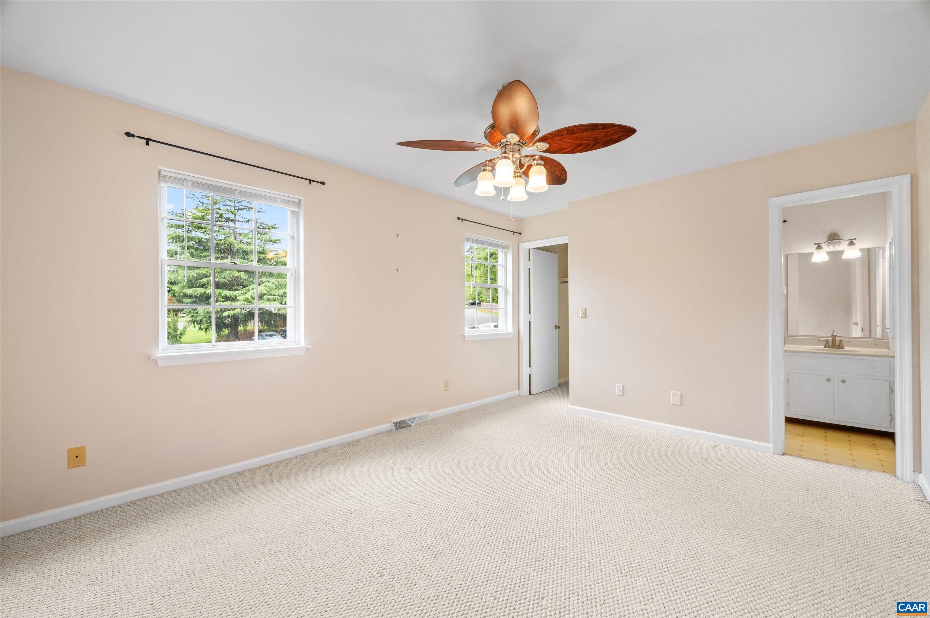 1616 Cool Spring Road Charlottesville, VA 22901 - Photo 21 of 38 an empty room with windows and a chandelier fan