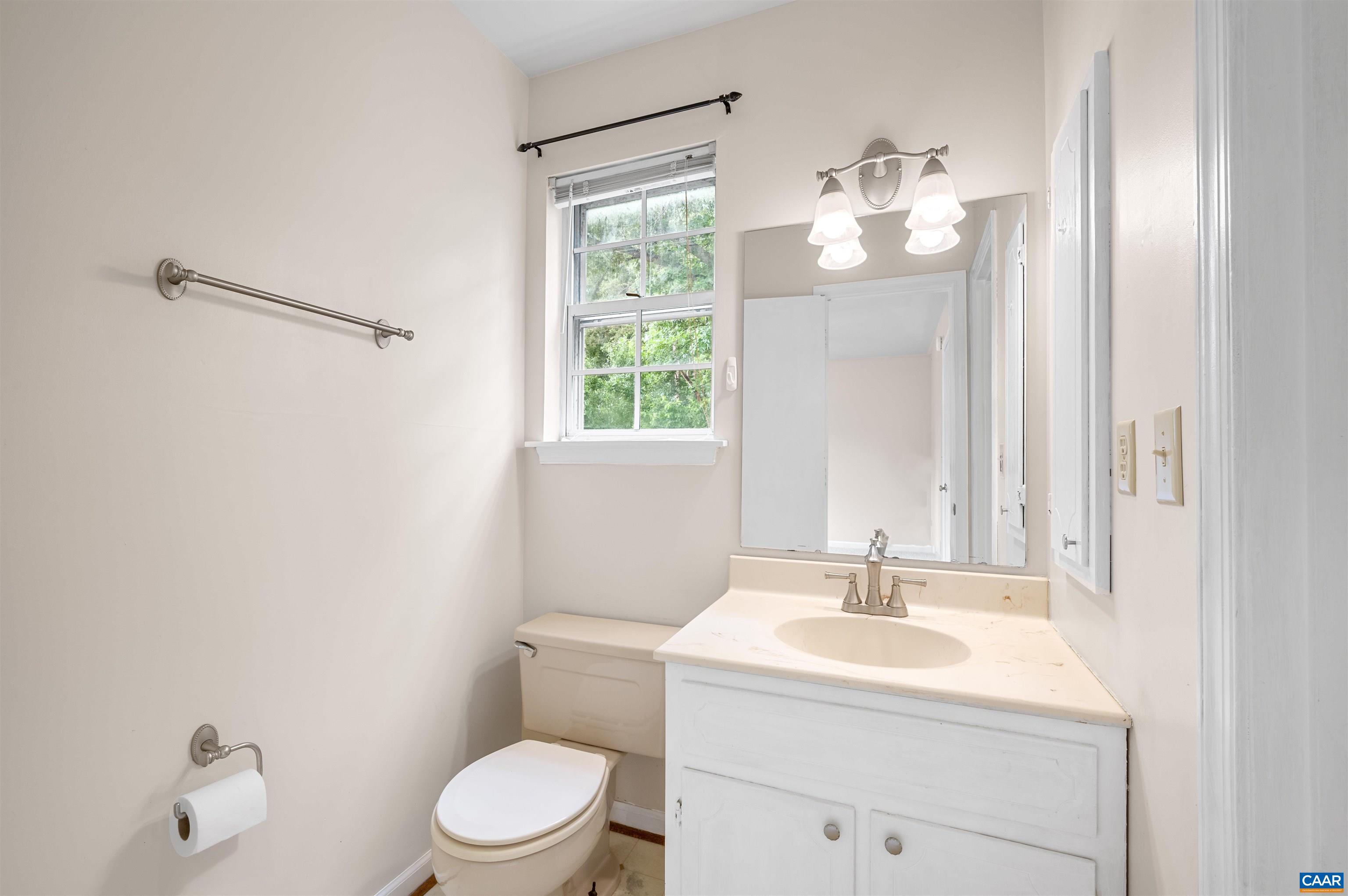 1616 Cool Spring Road Charlottesville, VA 22901 - Photo 23 of 38 a bathroom with a sink a toilet and a mirror