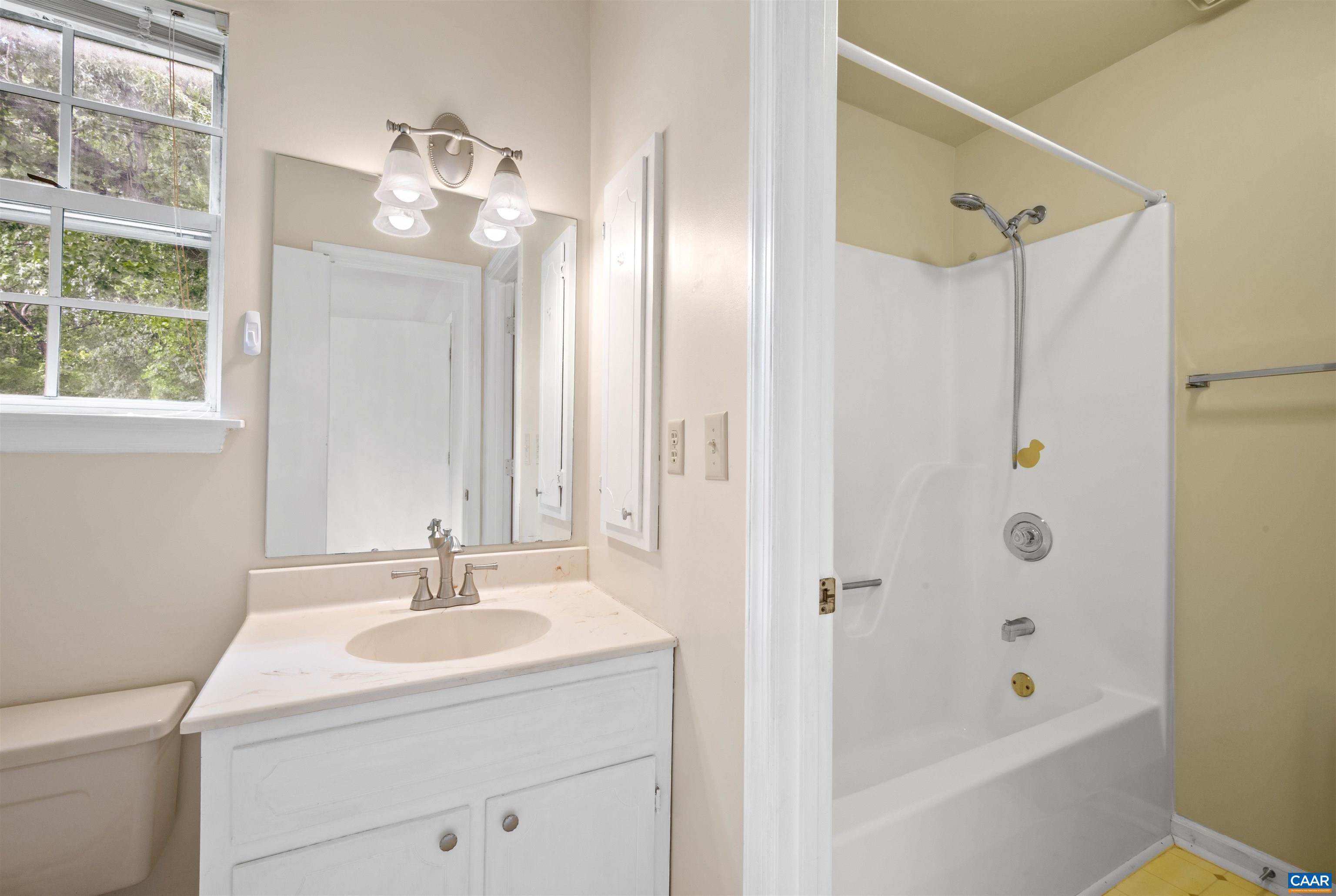 1616 Cool Spring Road Charlottesville, VA 22901 - Photo 24 of 38 a bathroom with a bath tub sink mirror and shower