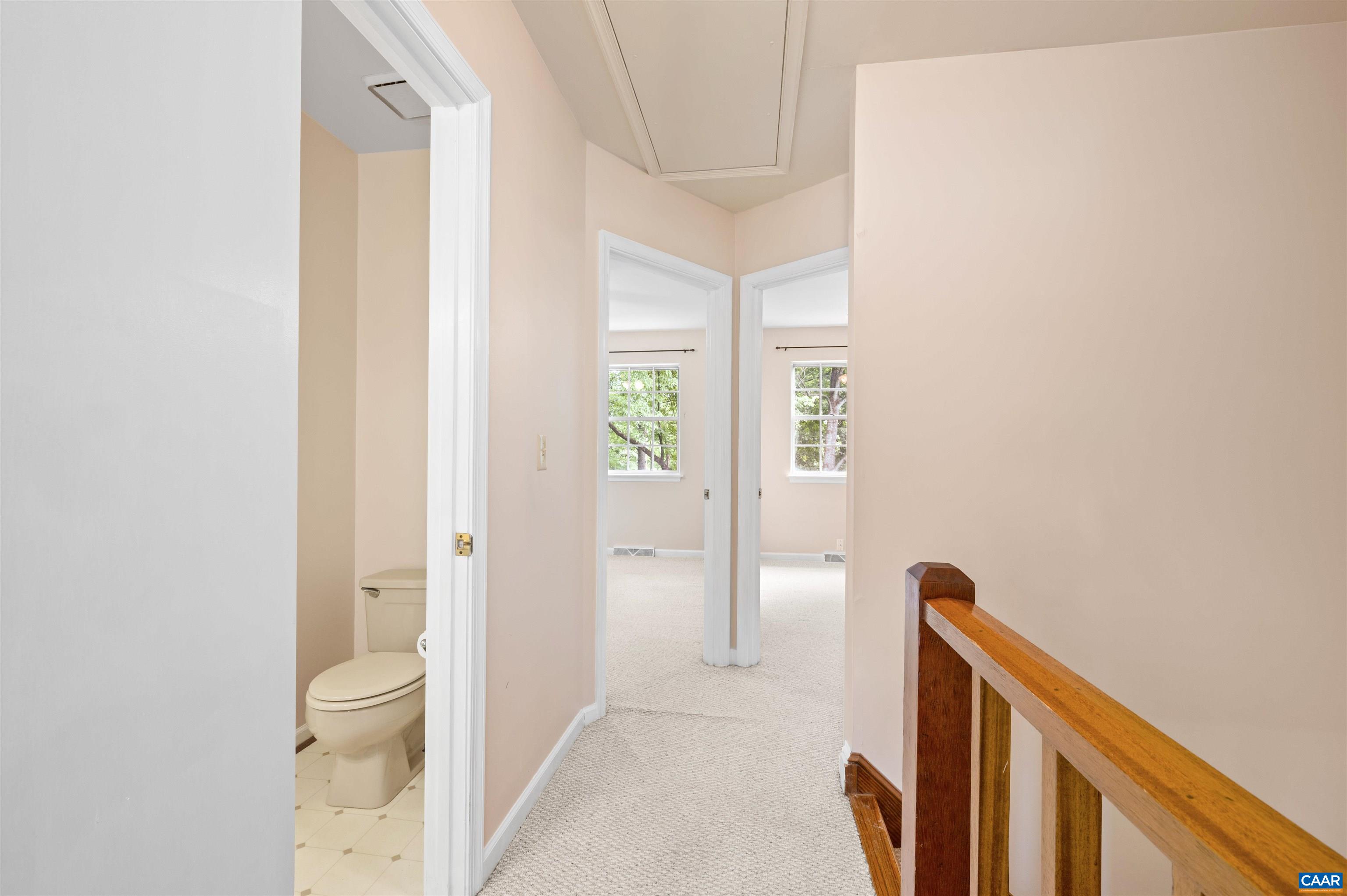 1616 Cool Spring Road Charlottesville, VA 22901 - Photo 27 of 38 a view of a hallway with bathroom and wooden floor