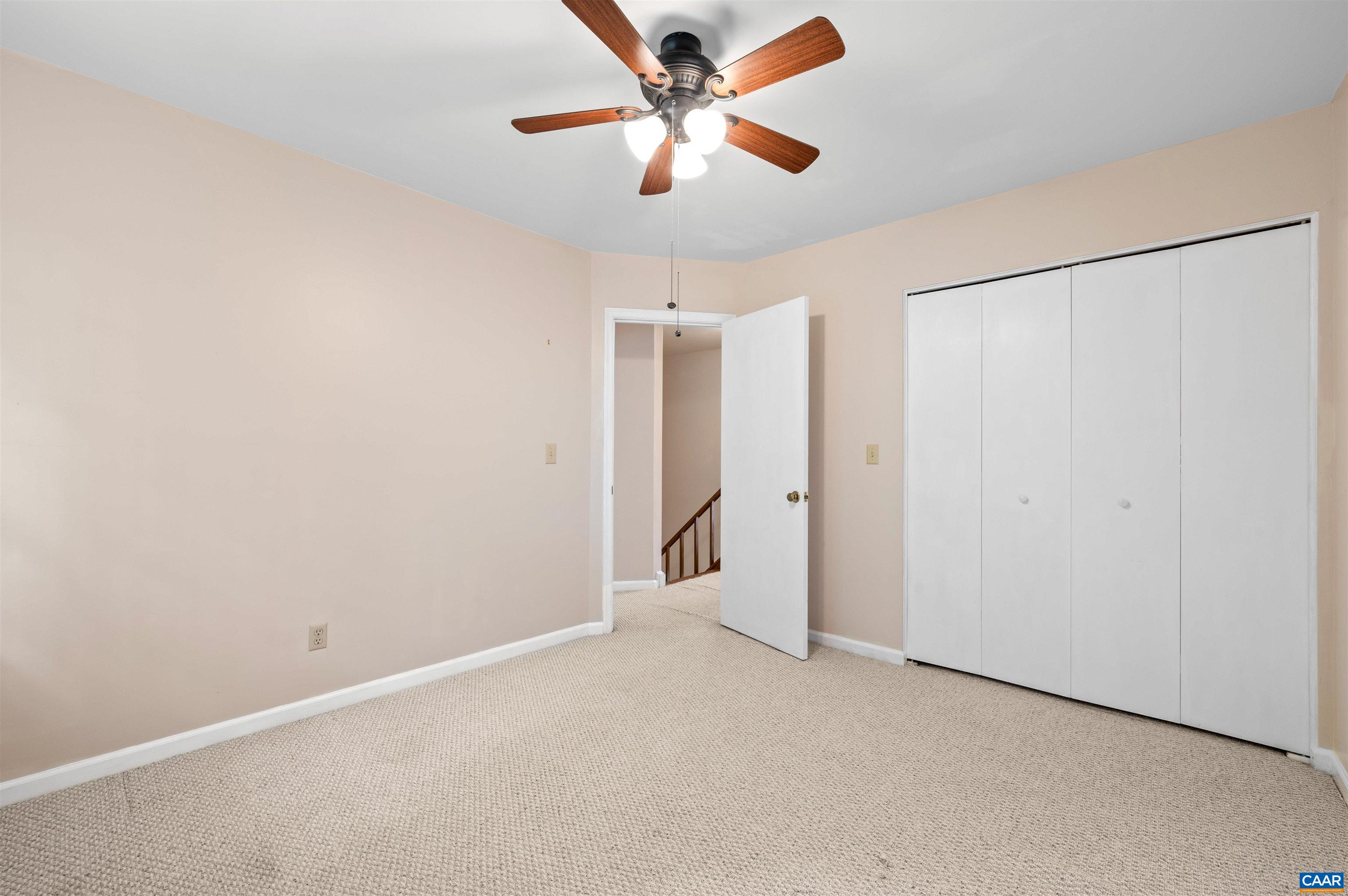 1616 Cool Spring Road Charlottesville, VA 22901 - Photo 29 of 38 an empty room with closet and a chandelier fan