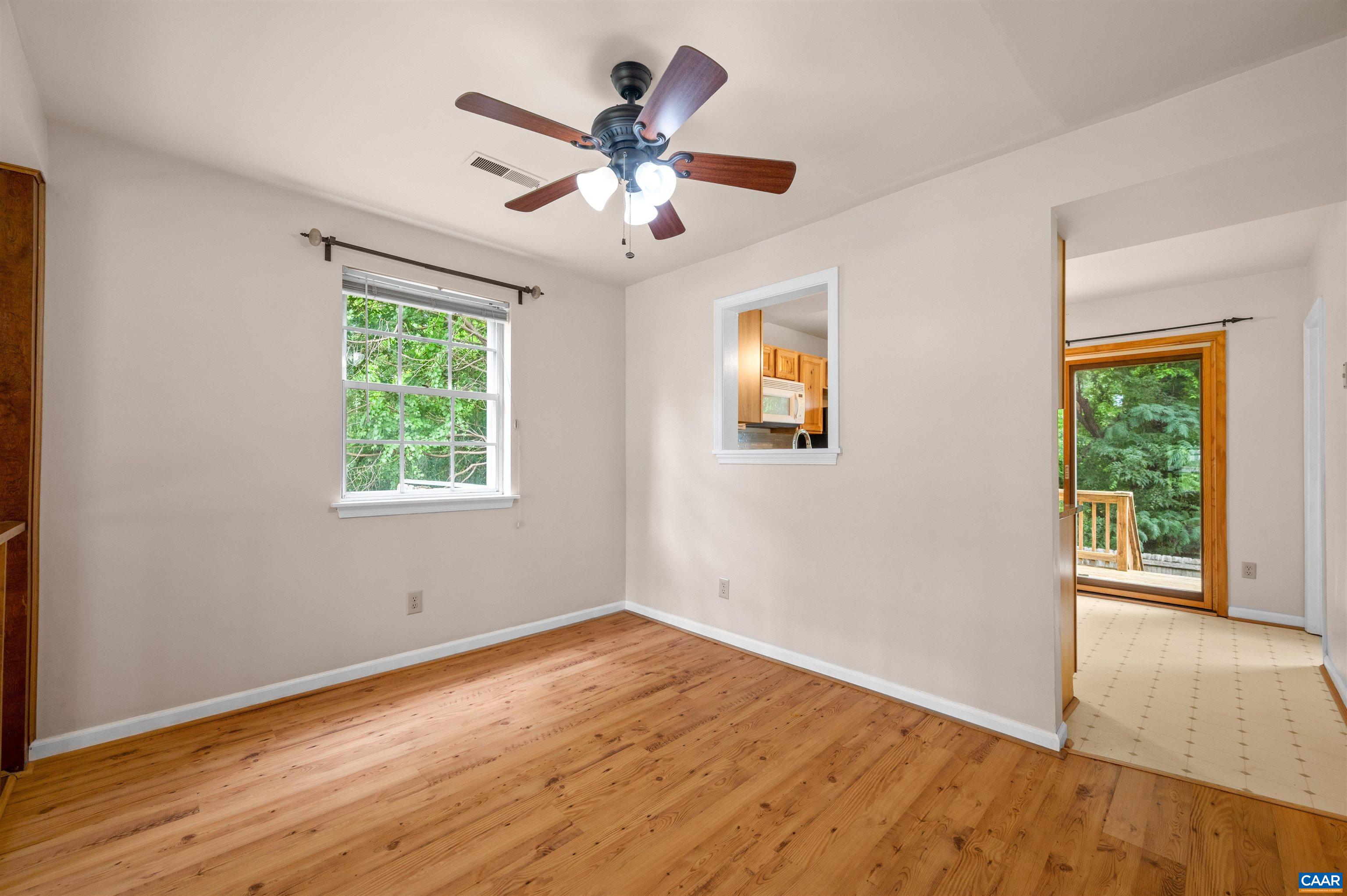 1616 Cool Spring Road Charlottesville, VA 22901 - Photo 9 of 38 a view of an empty room with wooden floor and a window