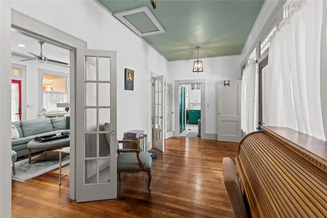 a view of an entryway with wooden floor and windows