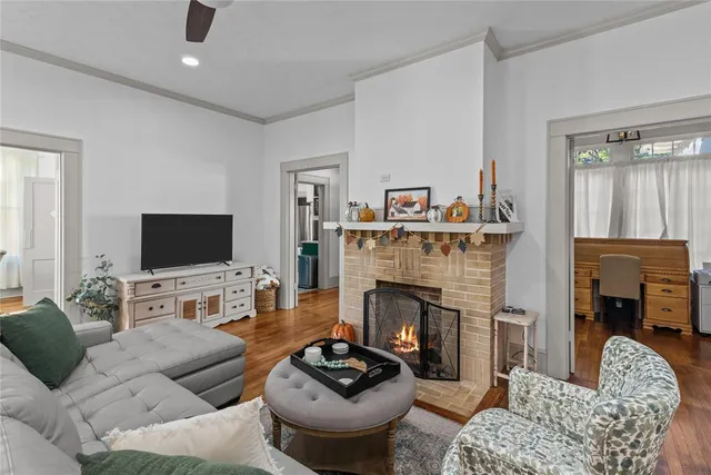 a living room with furniture and a fireplace