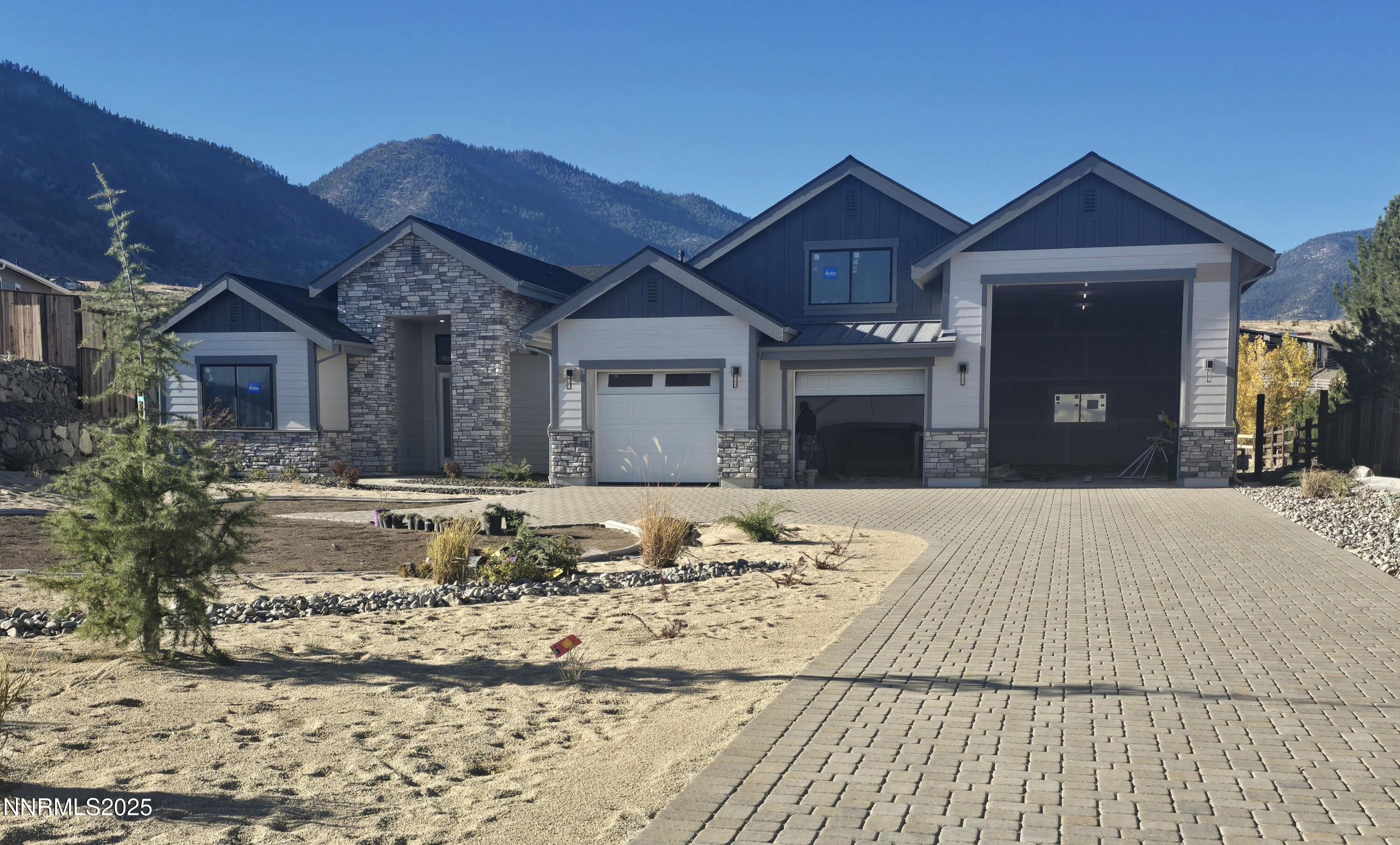 2902 Promontory Drive Genoa, NV 89411 - Photo 2 of 12 a front view of a house with a yard