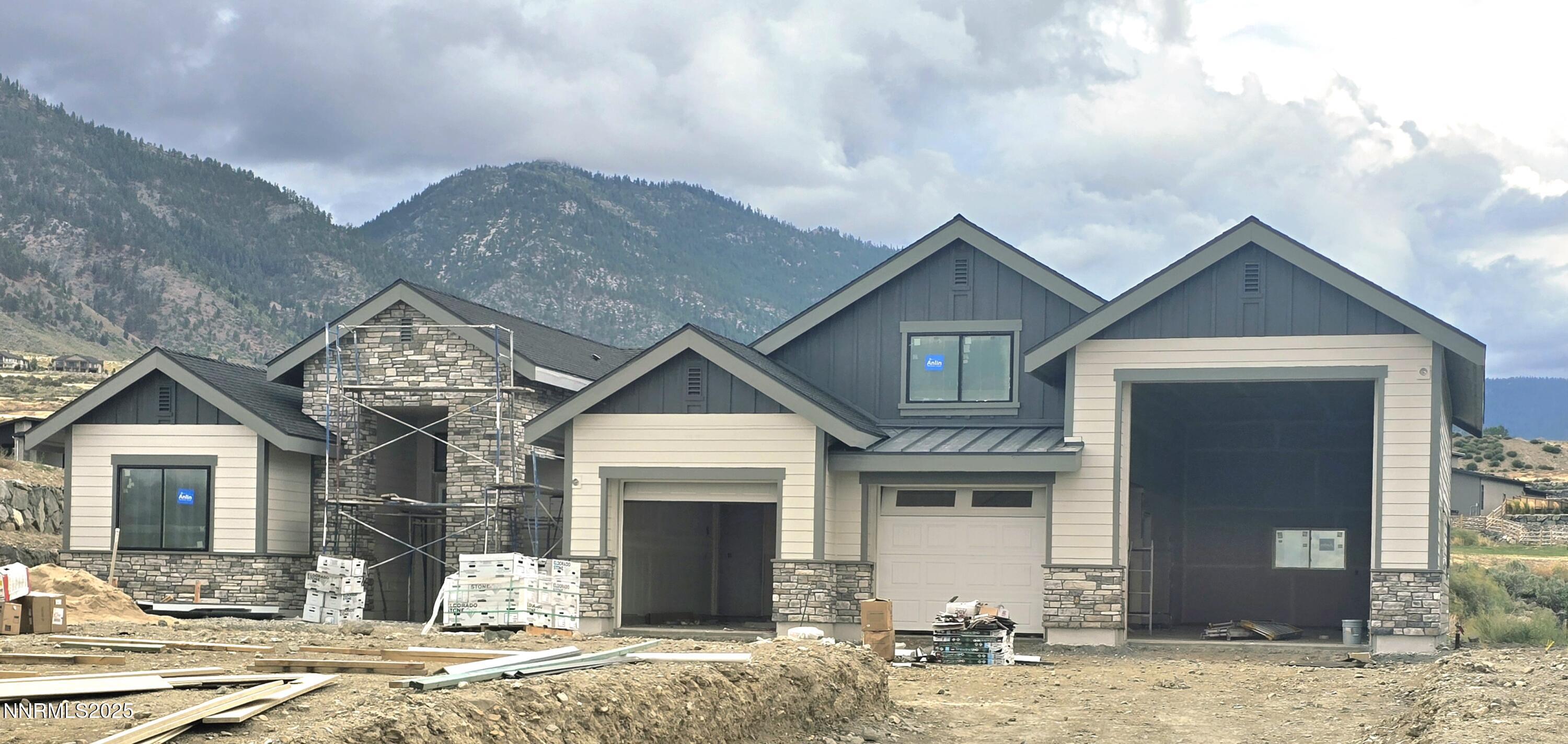 2902 Promontory Drive Genoa, NV 89411 - Photo 3 of 12 a front view of a house with a yard