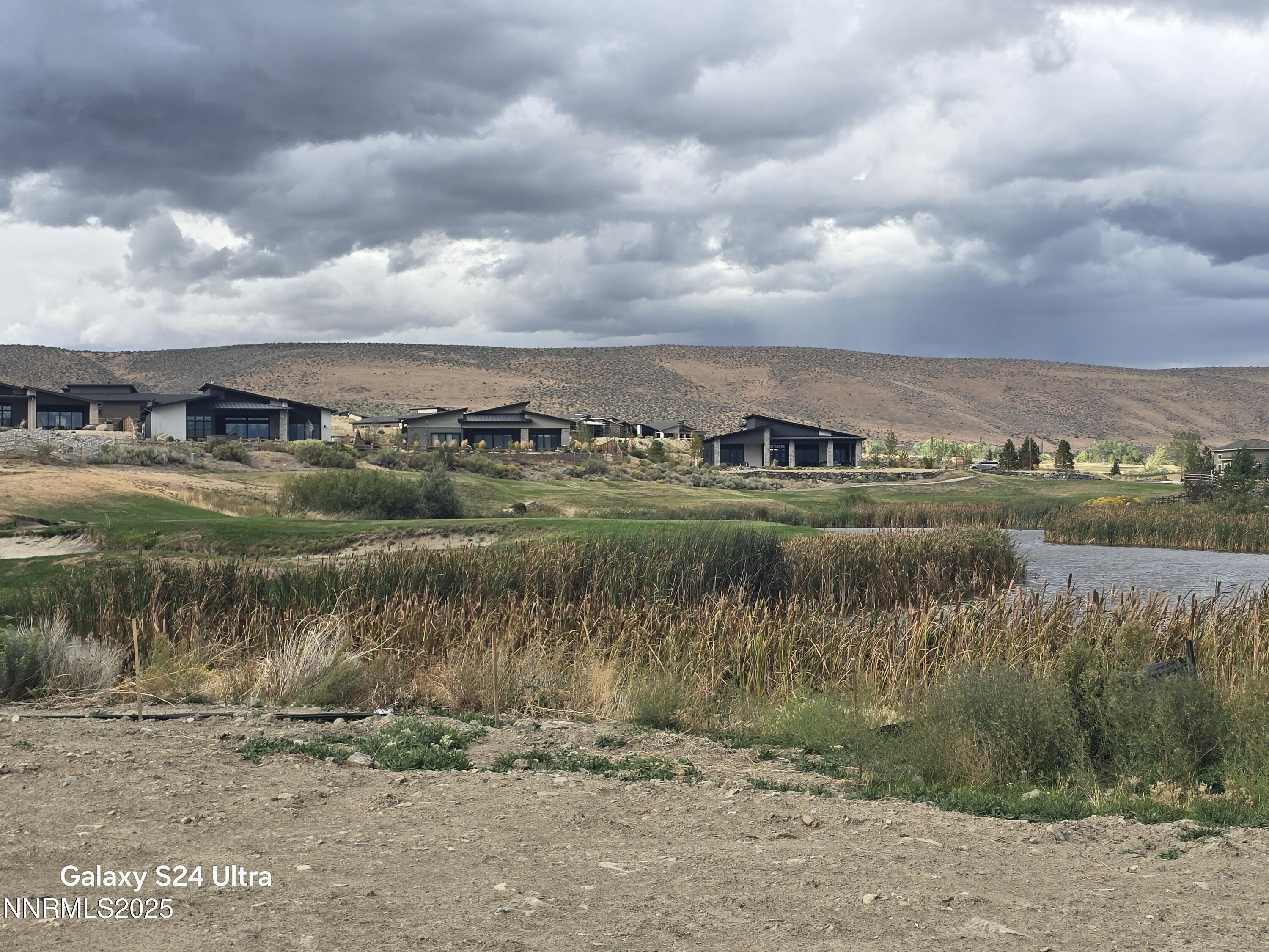 2902 Promontory Drive Genoa, NV 89411 - Photo 5 of 12 a view of a lake with houses in back