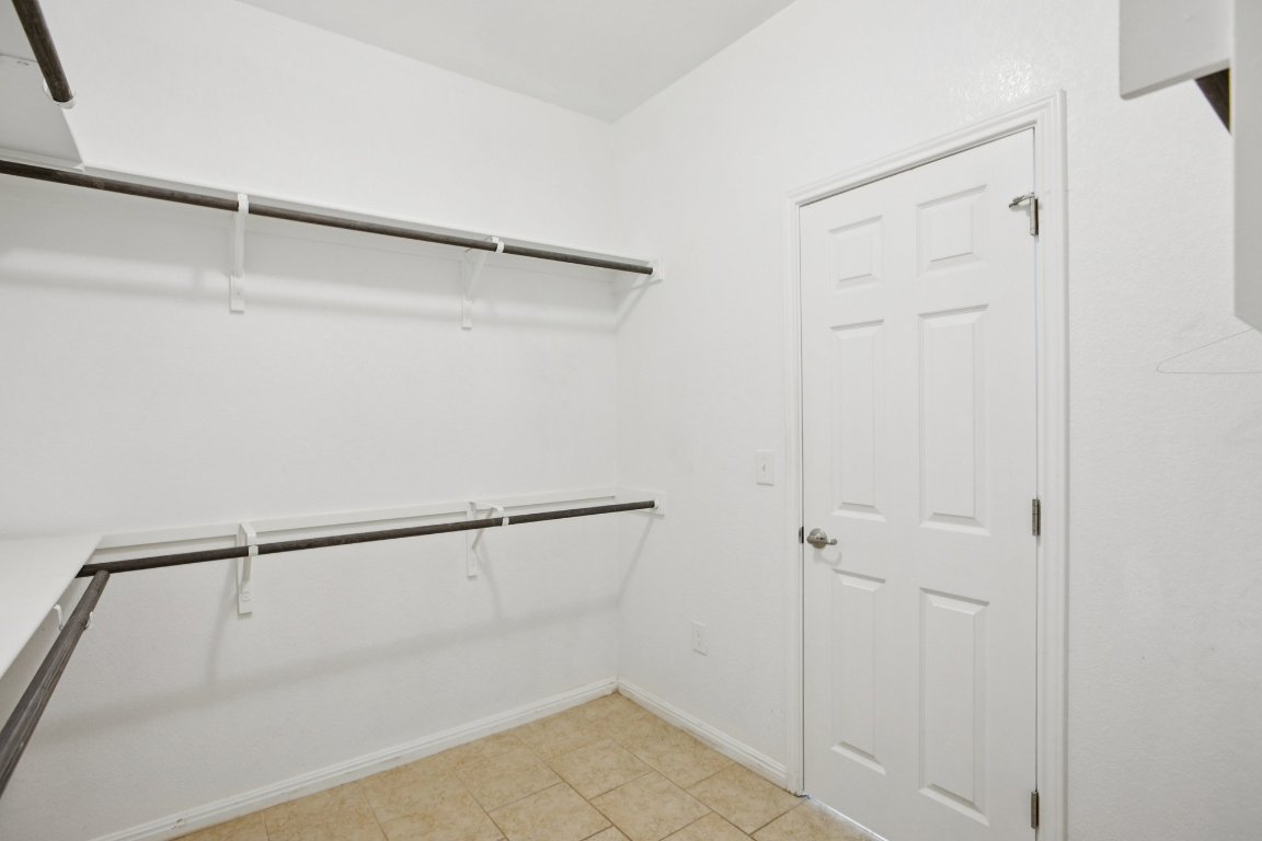 176 Mayney Ln. Leander, TX 78641 - Photo 21 of 34 Spacious closet with light tile patterned floors