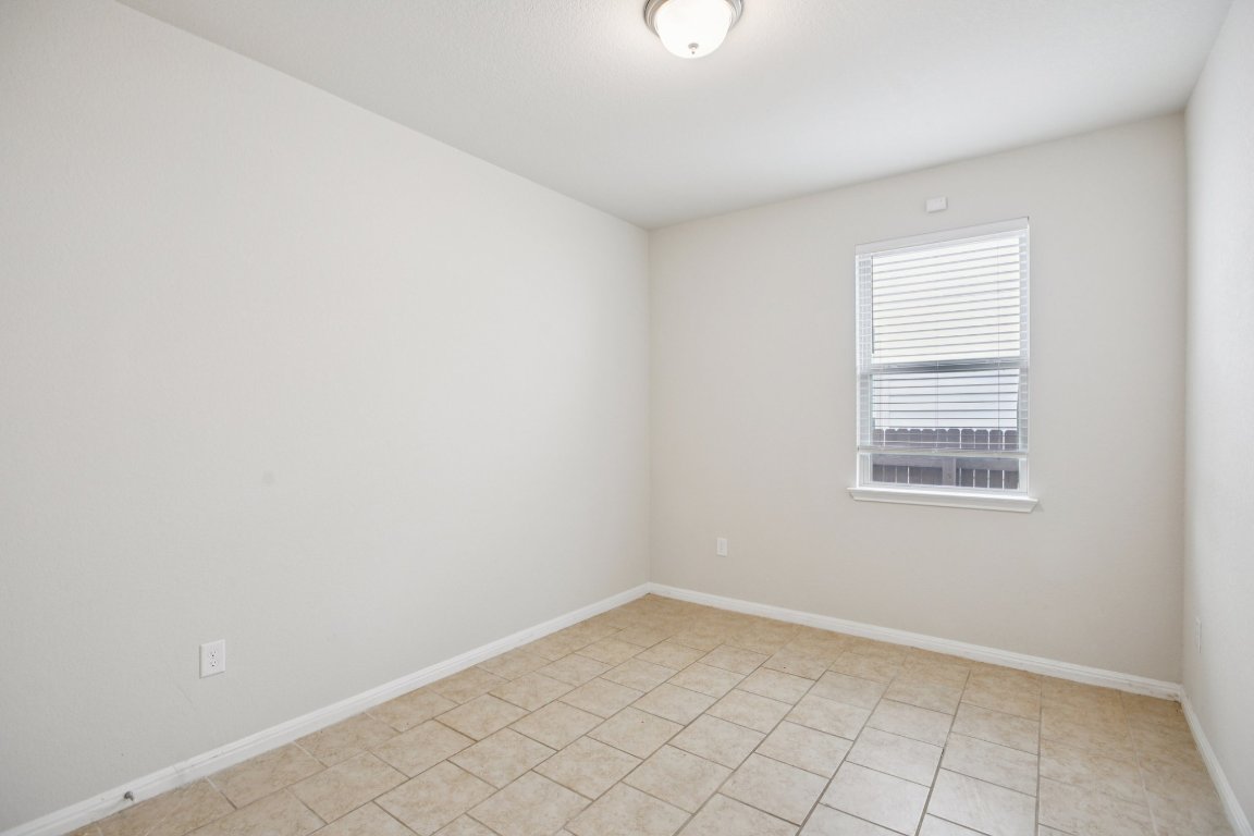 176 Mayney Ln. Leander, TX 78641 - Photo 26 of 34 Empty room featuring baseboards and light tile patterned floors