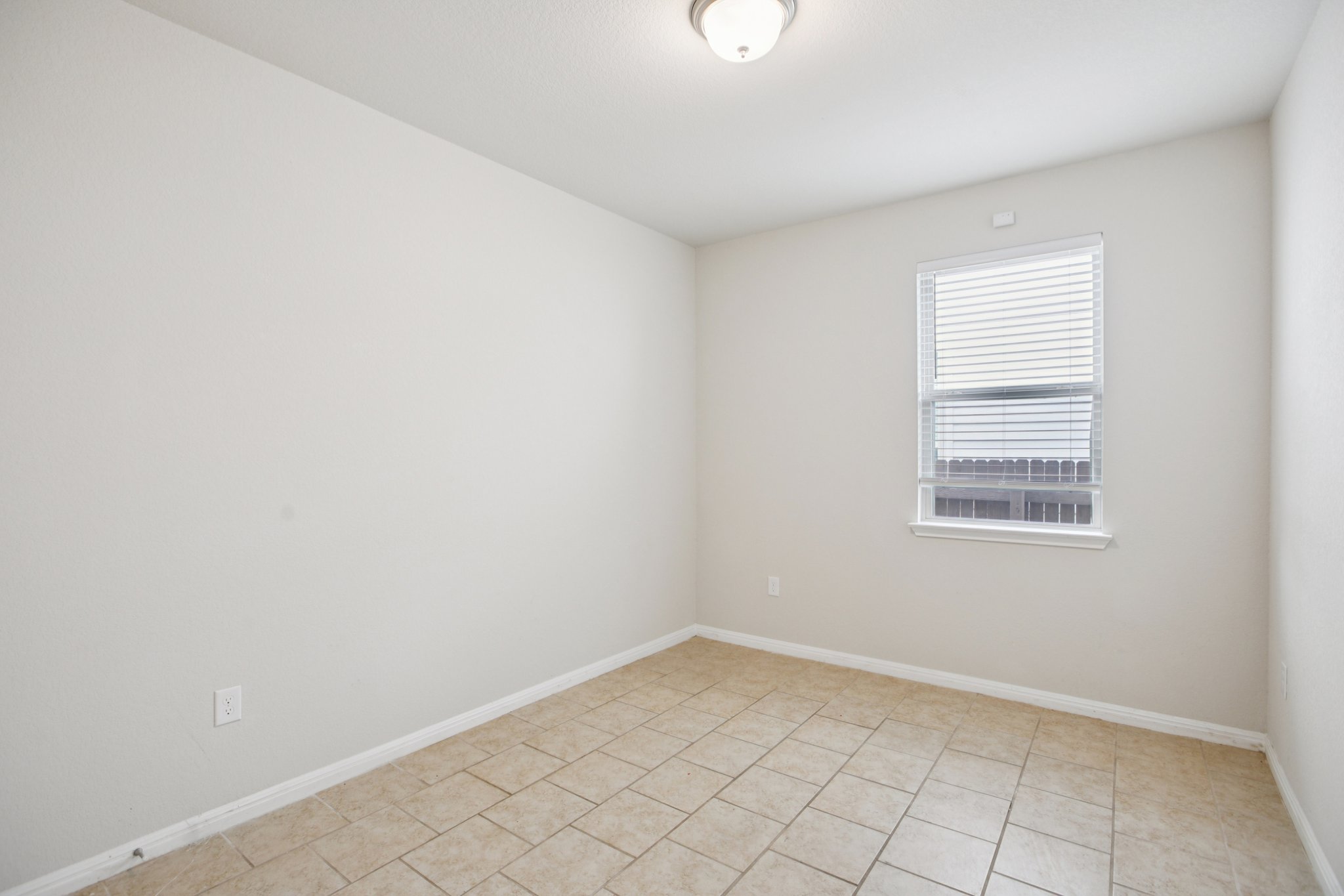176 Mayney Ln. Leander, TX 78641 - Photo 29 of 37 Empty room featuring baseboards and light tile patterned floors