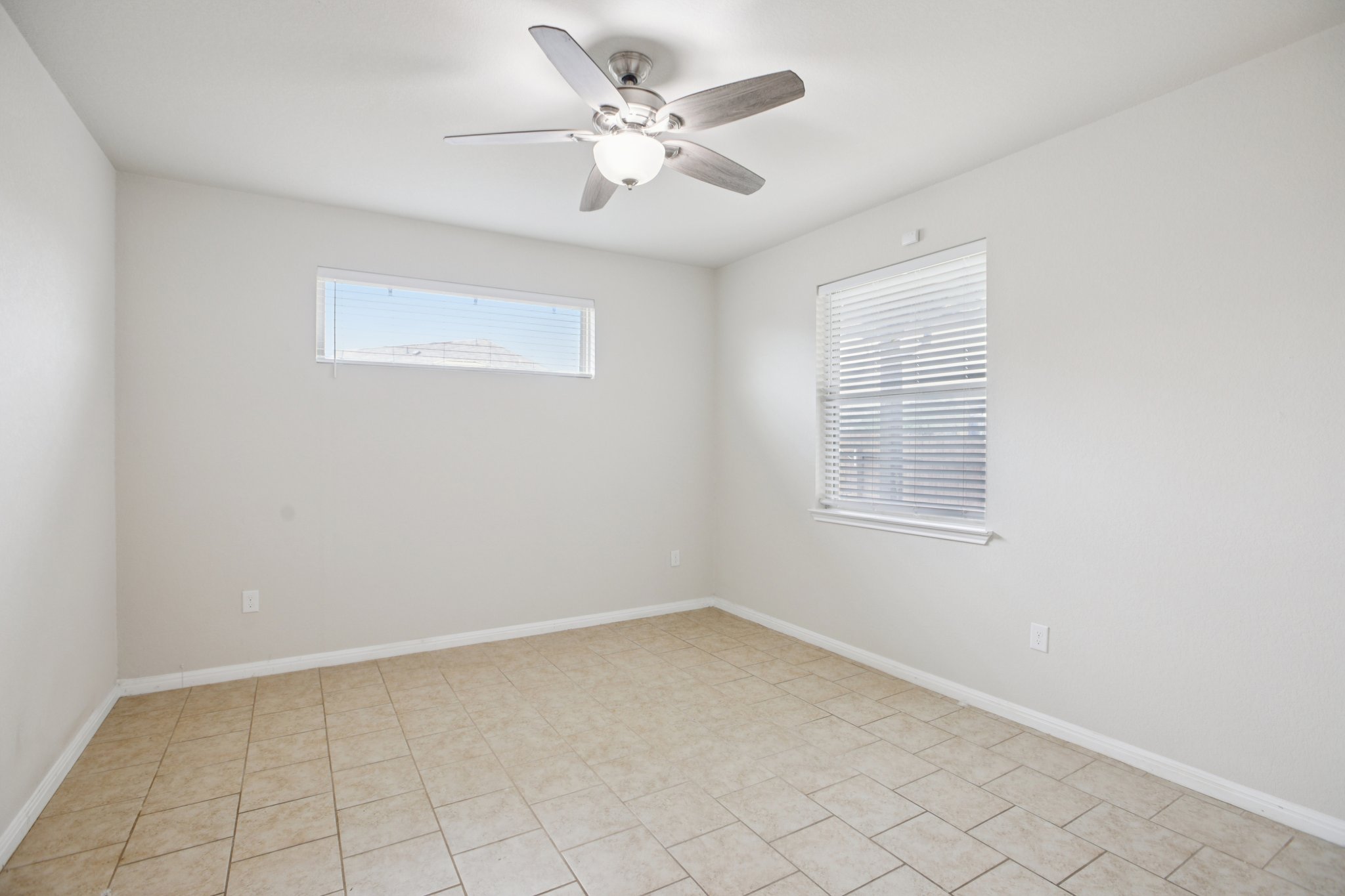 176 Mayney Ln. Leander, TX 78641 - Photo 31 of 37 Empty room featuring plenty of natural light and a ceiling fan