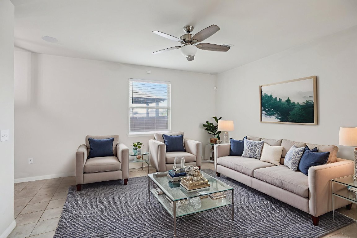 176 Mayney Ln. Leander, TX 78641 - Photo 6 of 34 Living area featuring light tile Virtually staged