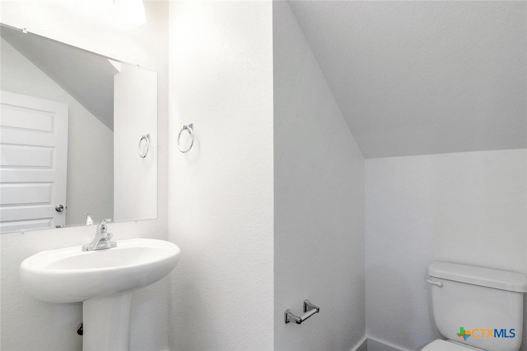 1920 Royal Loop Belton, TX 76513 - Photo 14 of 15 a bathroom with a sink and a mirror
