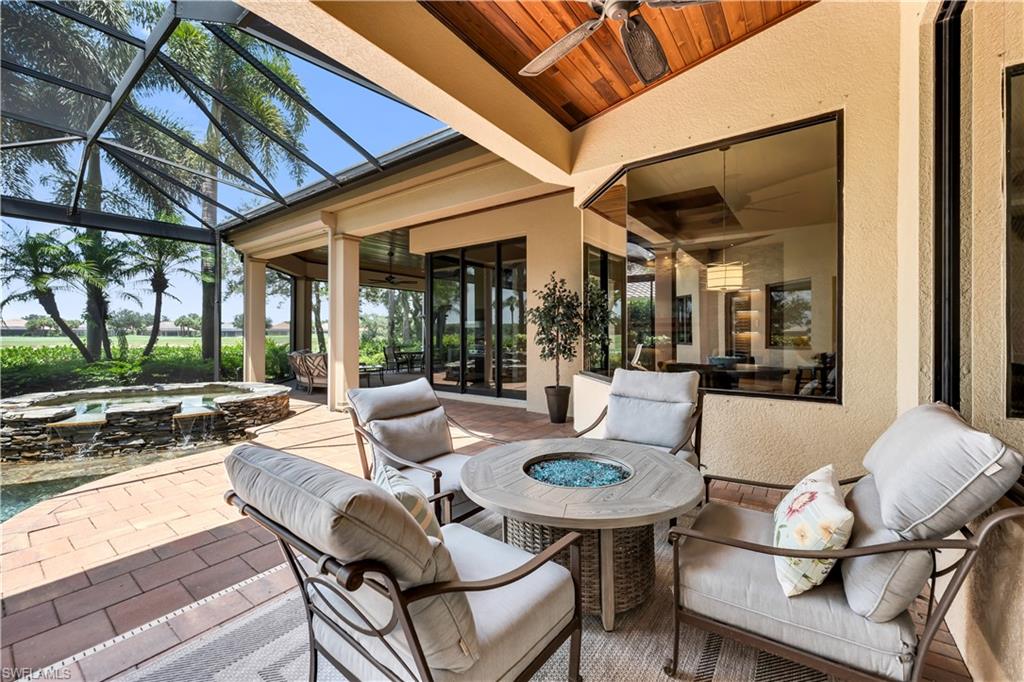 11875 Hedgestone Court Naples, FL 34120 - Photo 25 of 29 Casual Sitting area with Fire Pit