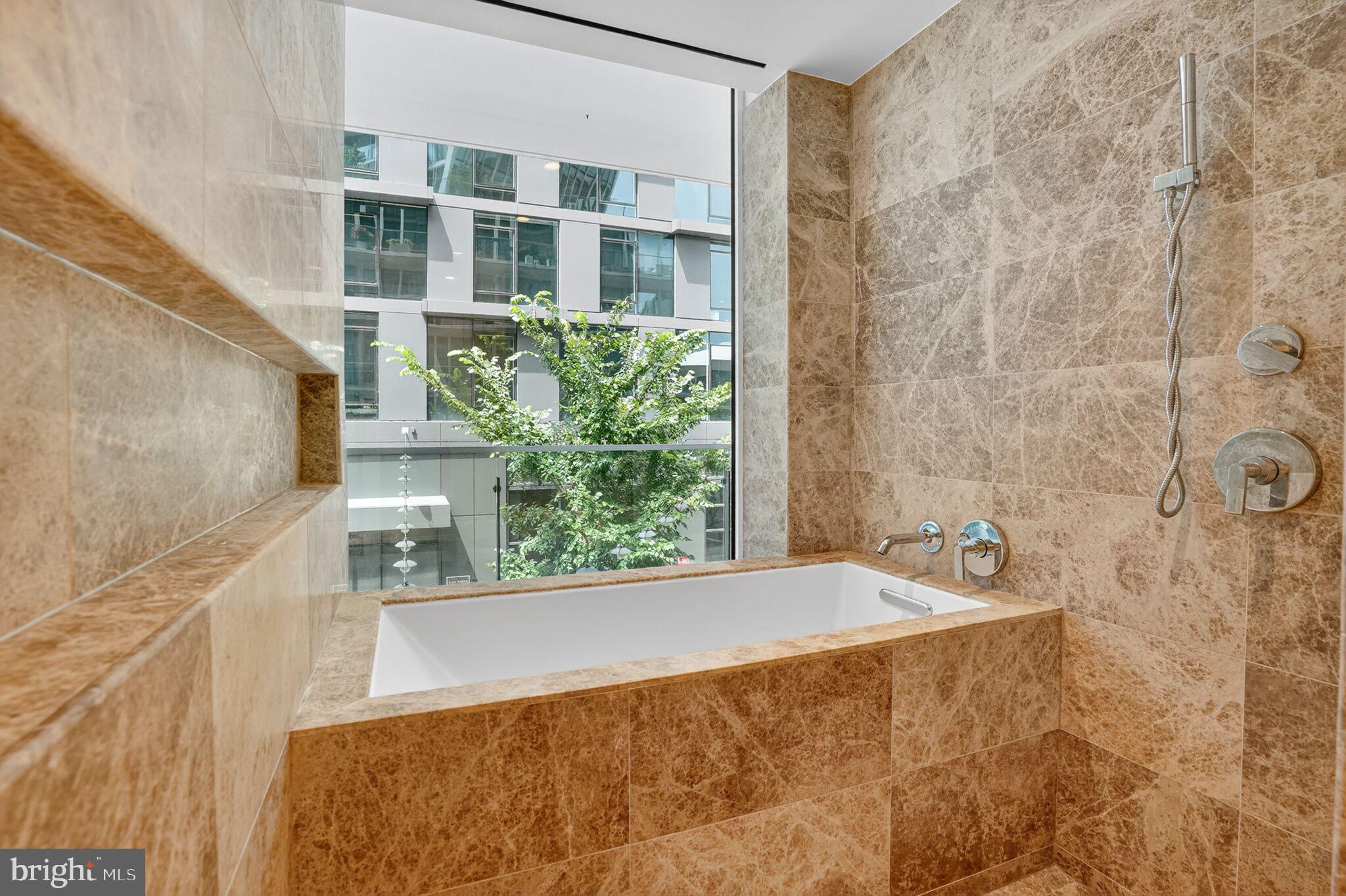 601 Wharf Street Southwest, Unit 213 Washington, DC 20024 - Photo 14 of 24 a view of bathroom with bathtub and shower
