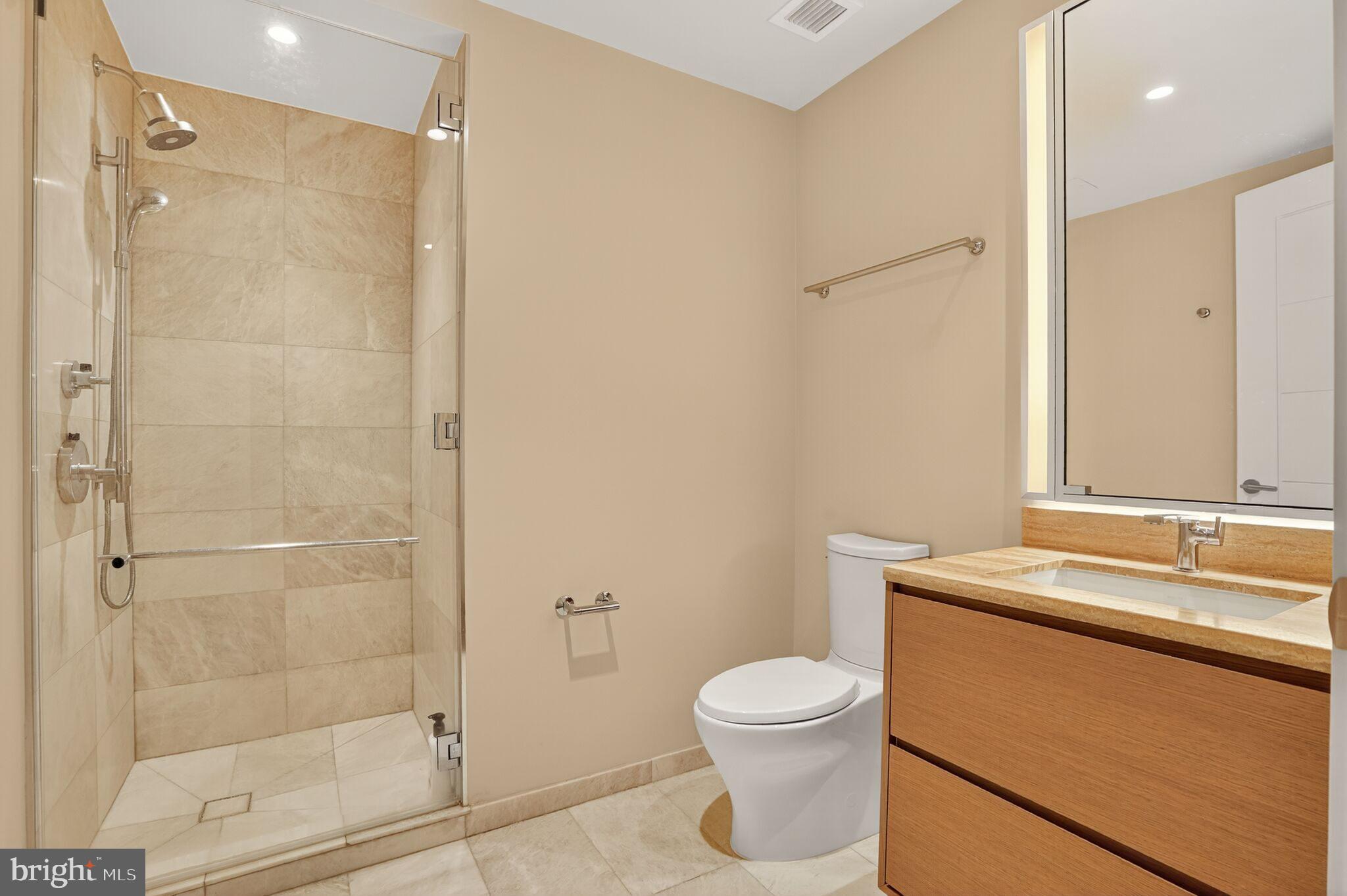601 Wharf Street Southwest, Unit 213 Washington, DC 20024 - Photo 16 of 24 a bathroom with a sink toilet and shower