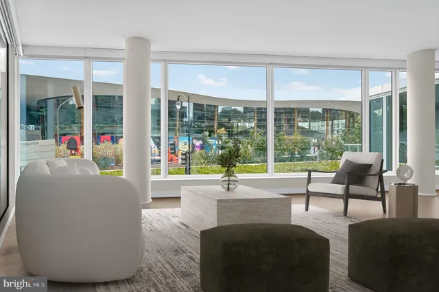 a living room with couch and windows