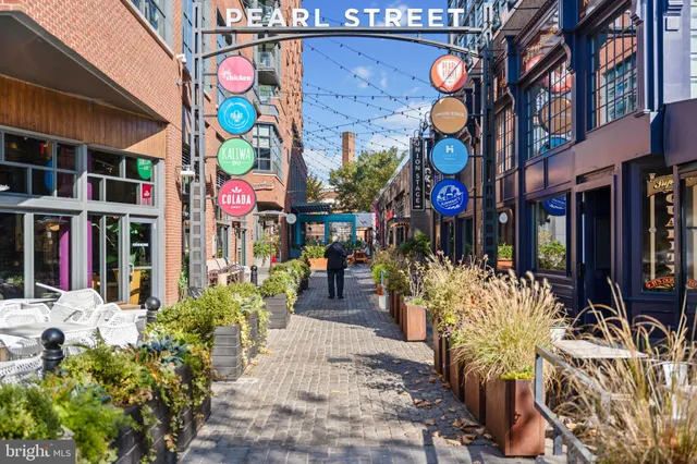 a view of path along with retail shop and buildings