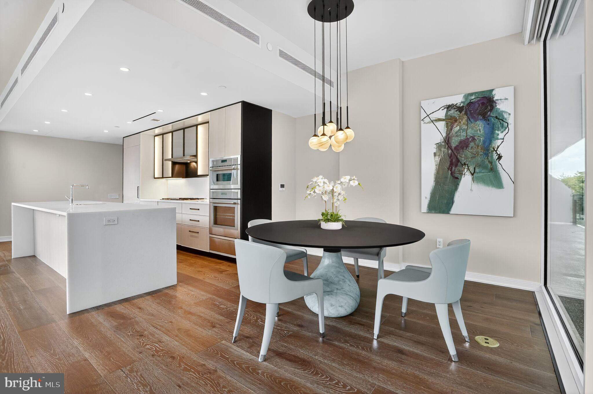 601 Wharf Street Southwest, Unit 213 Washington, DC 20024 - Photo 7 of 24 a view of a dining room with furniture window and wooden floor