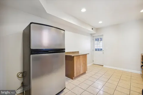 a view of kitchen with furniture and wooden floor
