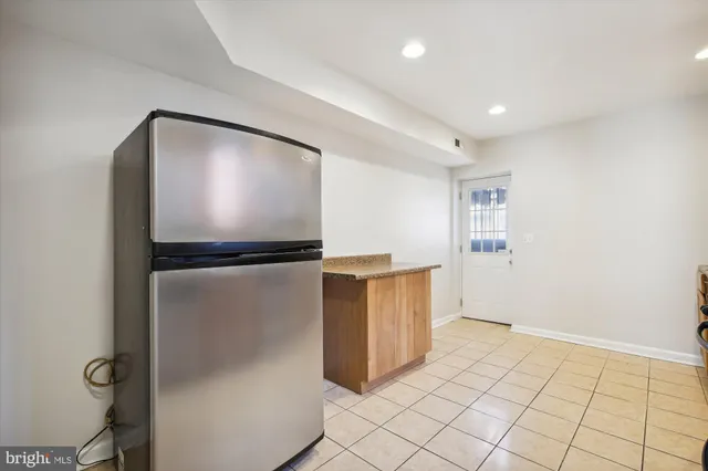 a view of kitchen with furniture and wooden floor