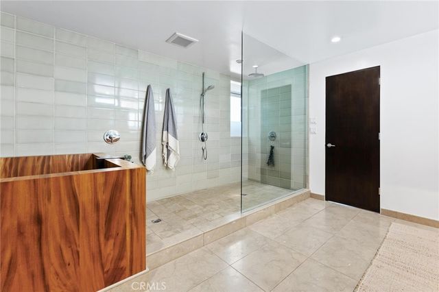 a bedroom with a bed and a painting