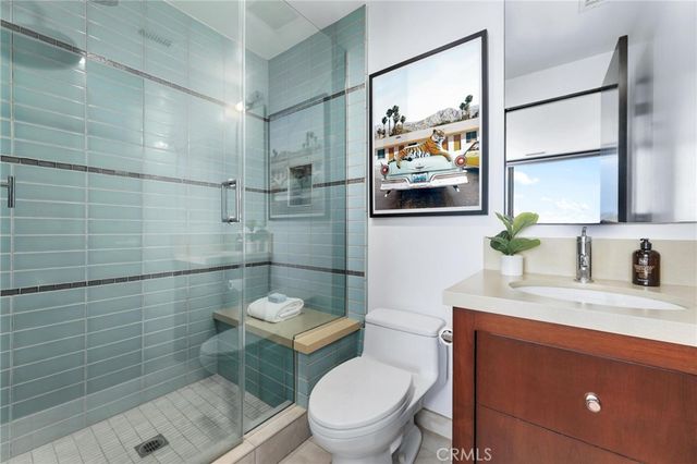 a view of a patio with couches chairs and a potted plant