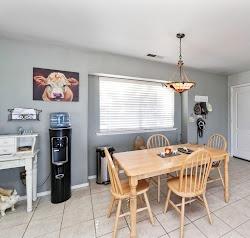 21780 Valley View Road Madera, CA 93638 - Photo 11 of 22 a dining room with a table and chairs