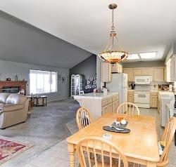 21780 Valley View Road Madera, CA 93638 - Photo 12 of 22 a dining room with wooden floor and kitchen view