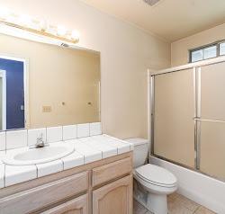 21780 Valley View Road Madera, CA 93638 - Photo 14 of 22 a bathroom with a sink and a mirror