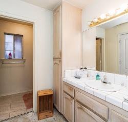 21780 Valley View Road Madera, CA 93638 - Photo 16 of 22 a bathroom with a sink and a mirror